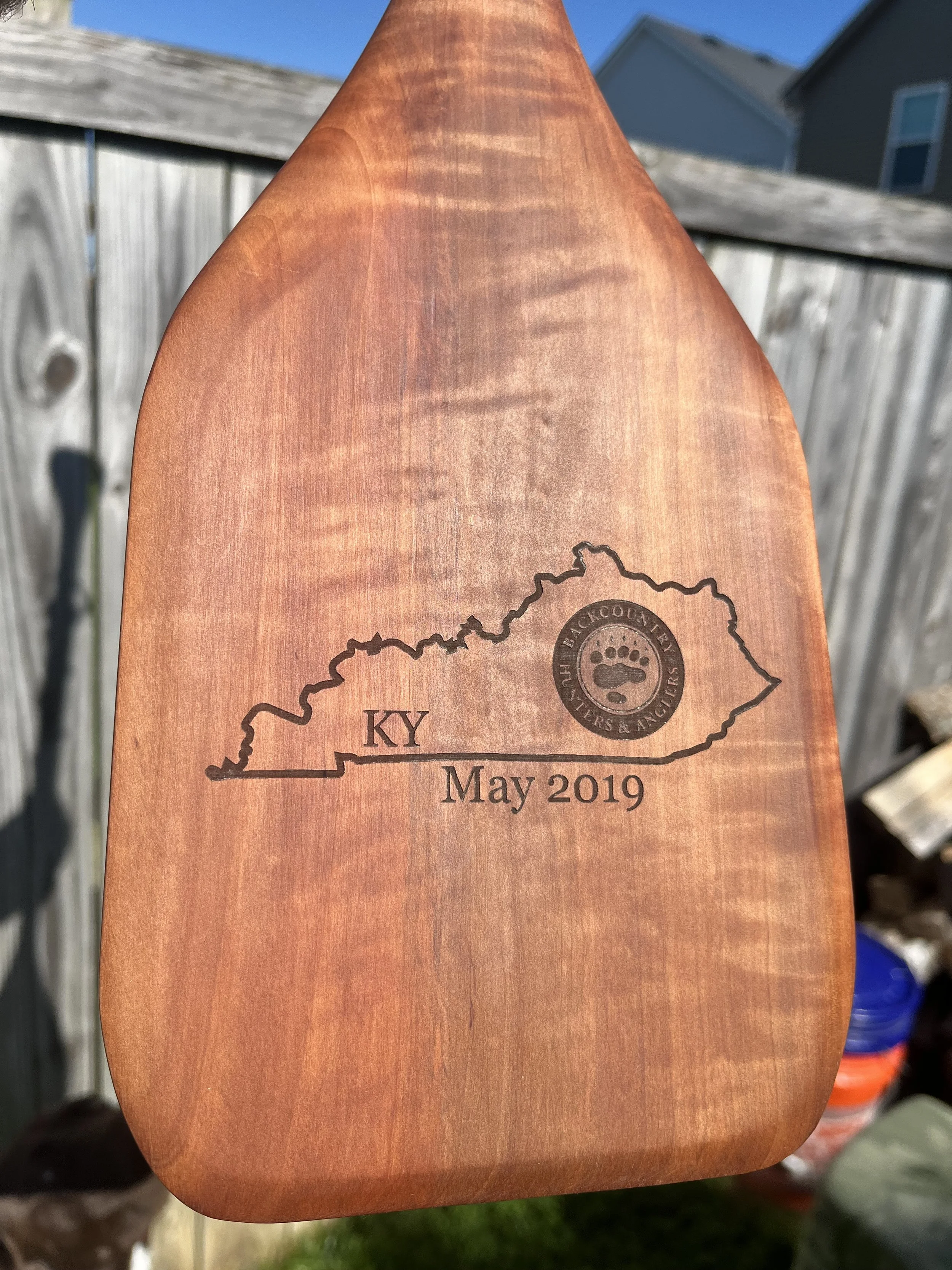 Engraved paddle award with decorative wrapped handle