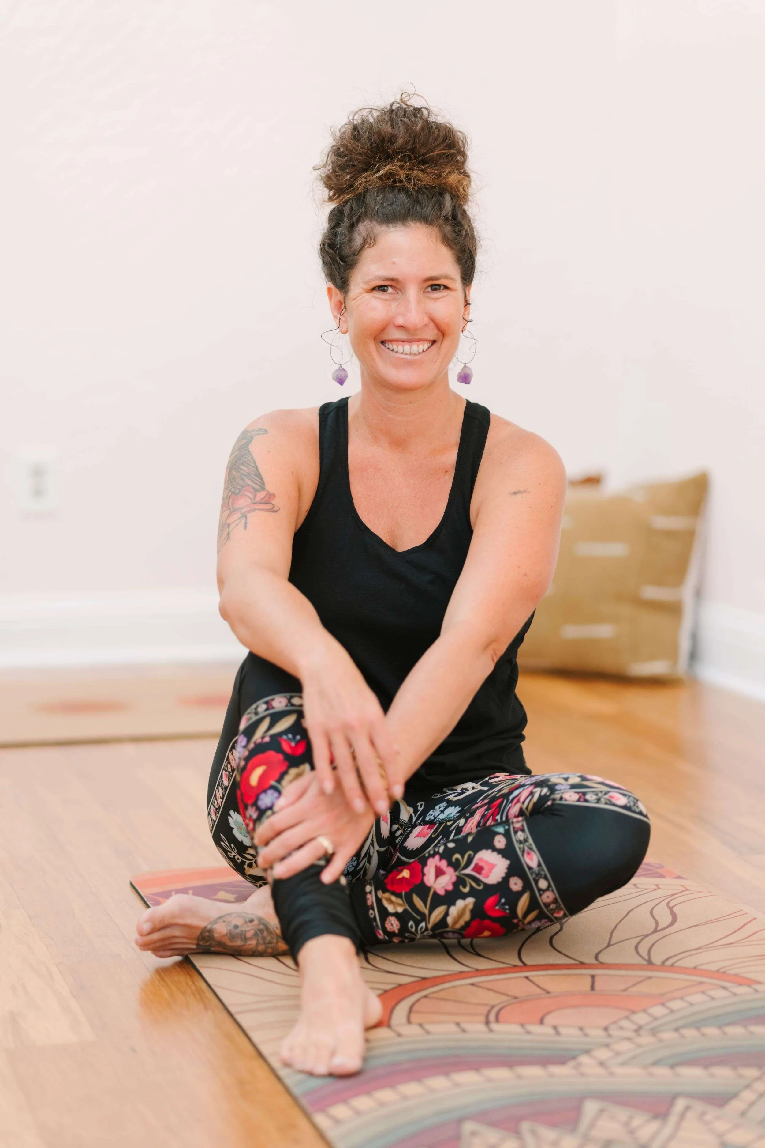 Robyn Brinkerhoff, founder of Empower Yoga & Mindfulness, leading a joyful yoga class with mindful movement and breathwork, fostering mind-body-heart connection and personal empowerment