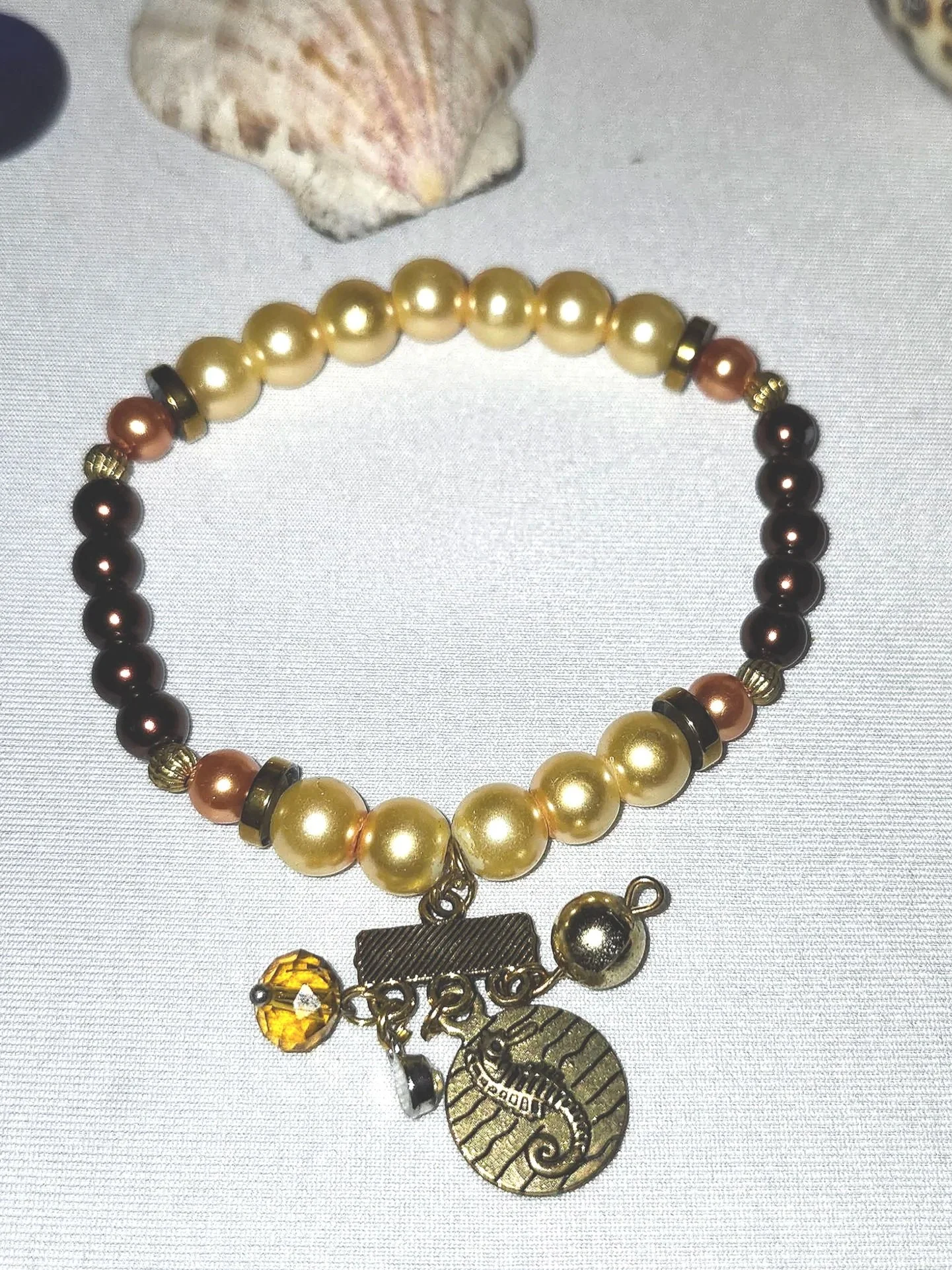 Pearly Bronze & Peach Beaded Stretch Bracelet With Seahorse Charm