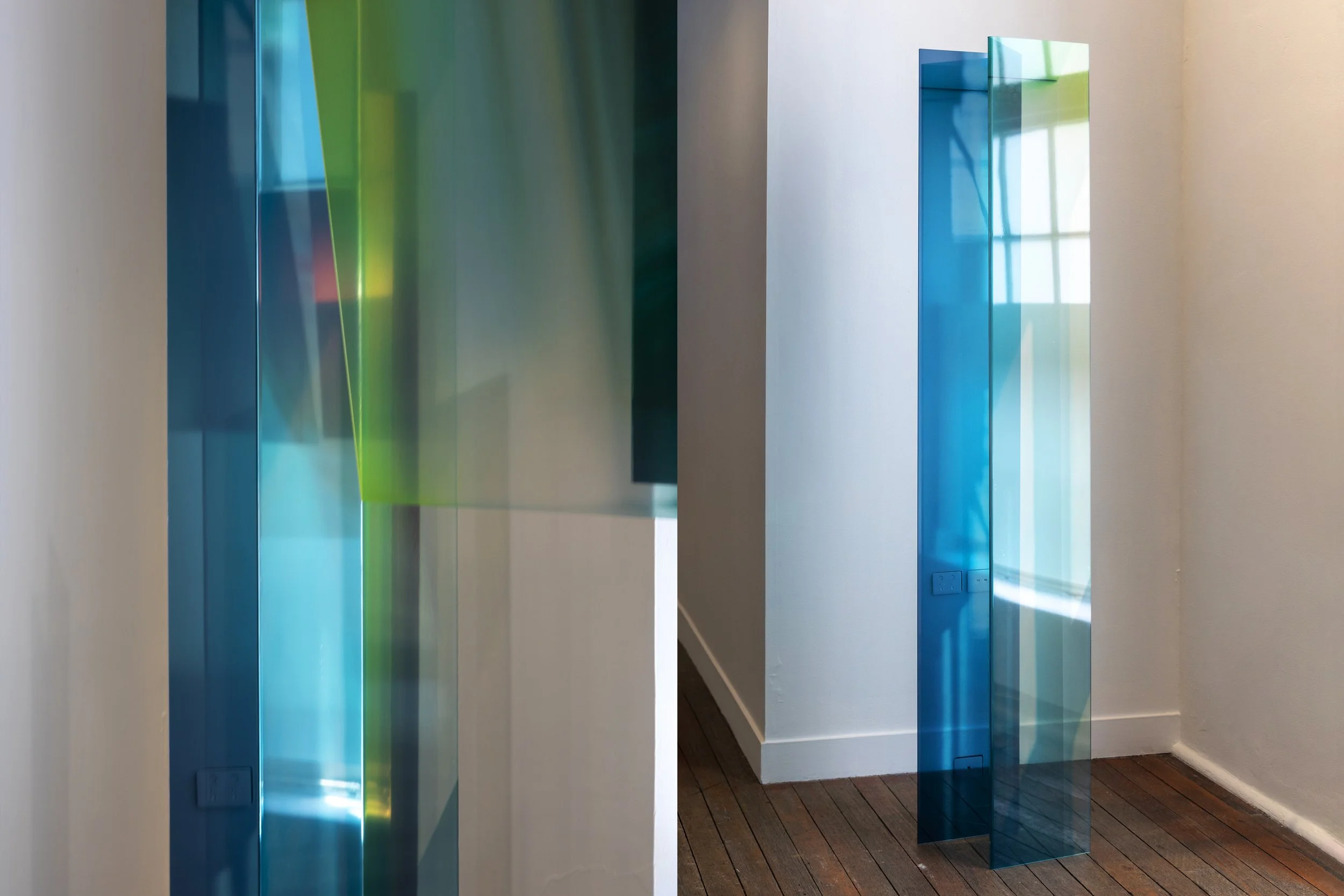 bracketing (2025) / left install view / transparent photo-media, folded acrylic, space, light / 2100 x 300 x 450 mm