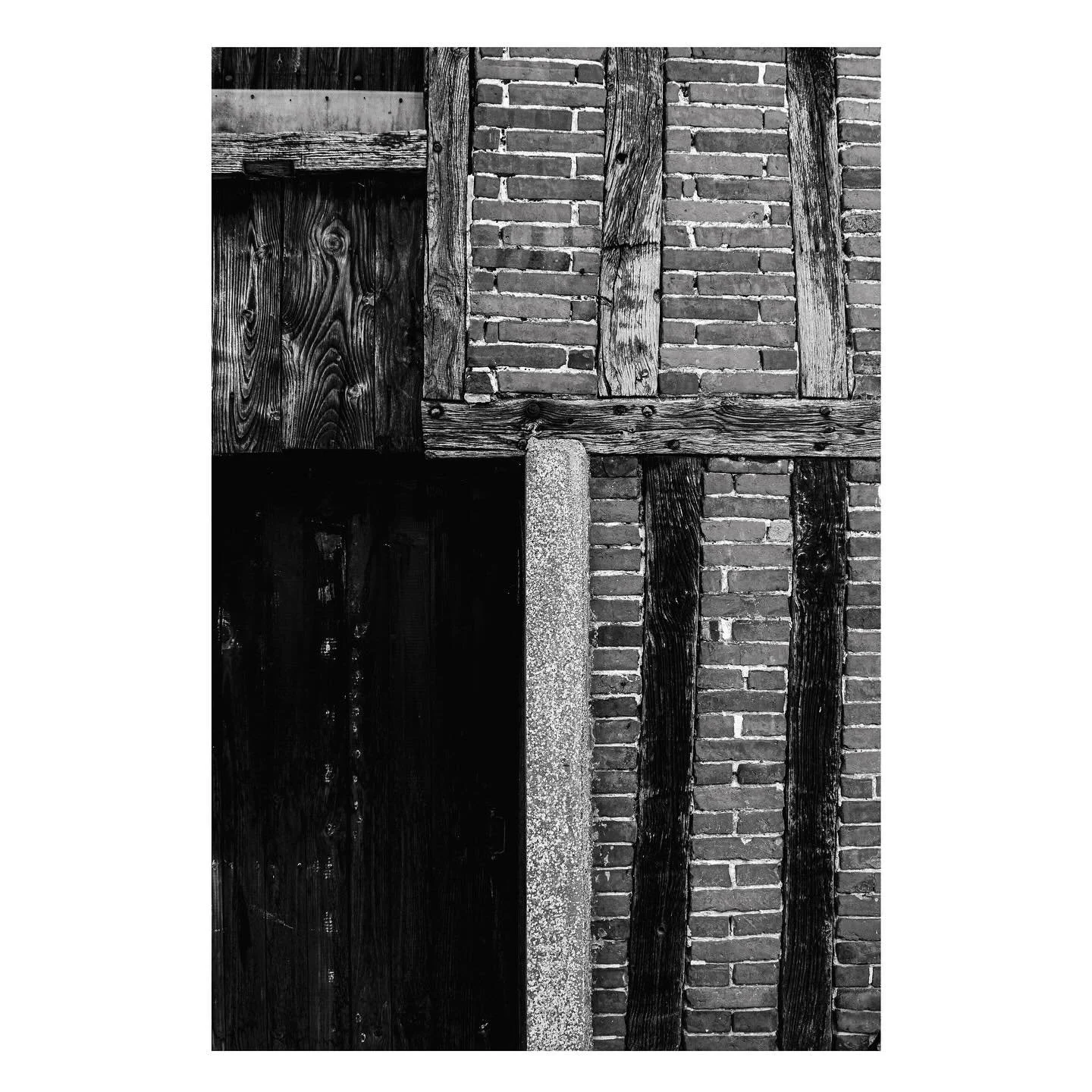 It must have taken patience to lay courses of bricks between the wonky timber sections in this building in Sainte-Gauburge-Sainte-Colombe in Normandy.

There is an unusual inversion of functions here, the timber is load bearing and the brick is not -