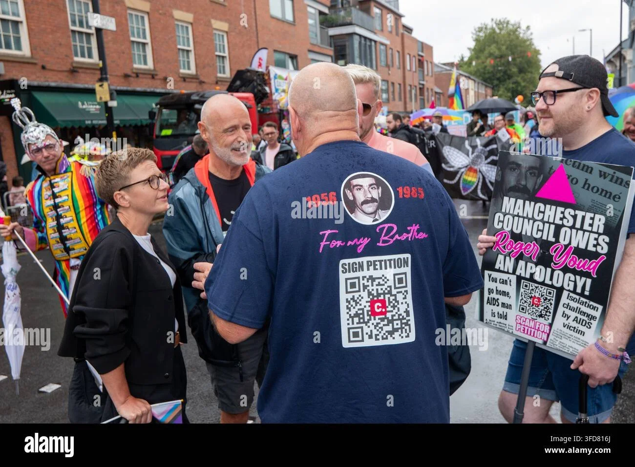 manchester-uk-august-29-2026-newly-elected-metro-mayor-bev-craig-engagers-with-campaigners-revelers-refuse-to-let-a-heavy-downpour-dampen-their-spirits-as-the-annual-parade-makes-its-way-through-the-city-centre-des.jpg