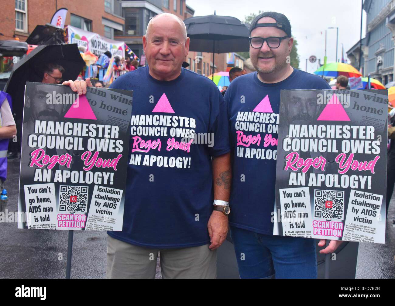 manchester-uk-29th-august-2026-people-at-the-manchester-lgbtq-village-pride-parade-men-with-placards-that-say-that-roger-youd-deserves-an-apology-from-manchester-city-council-in-1985-roger-george-youd-was-the-only-.jpg