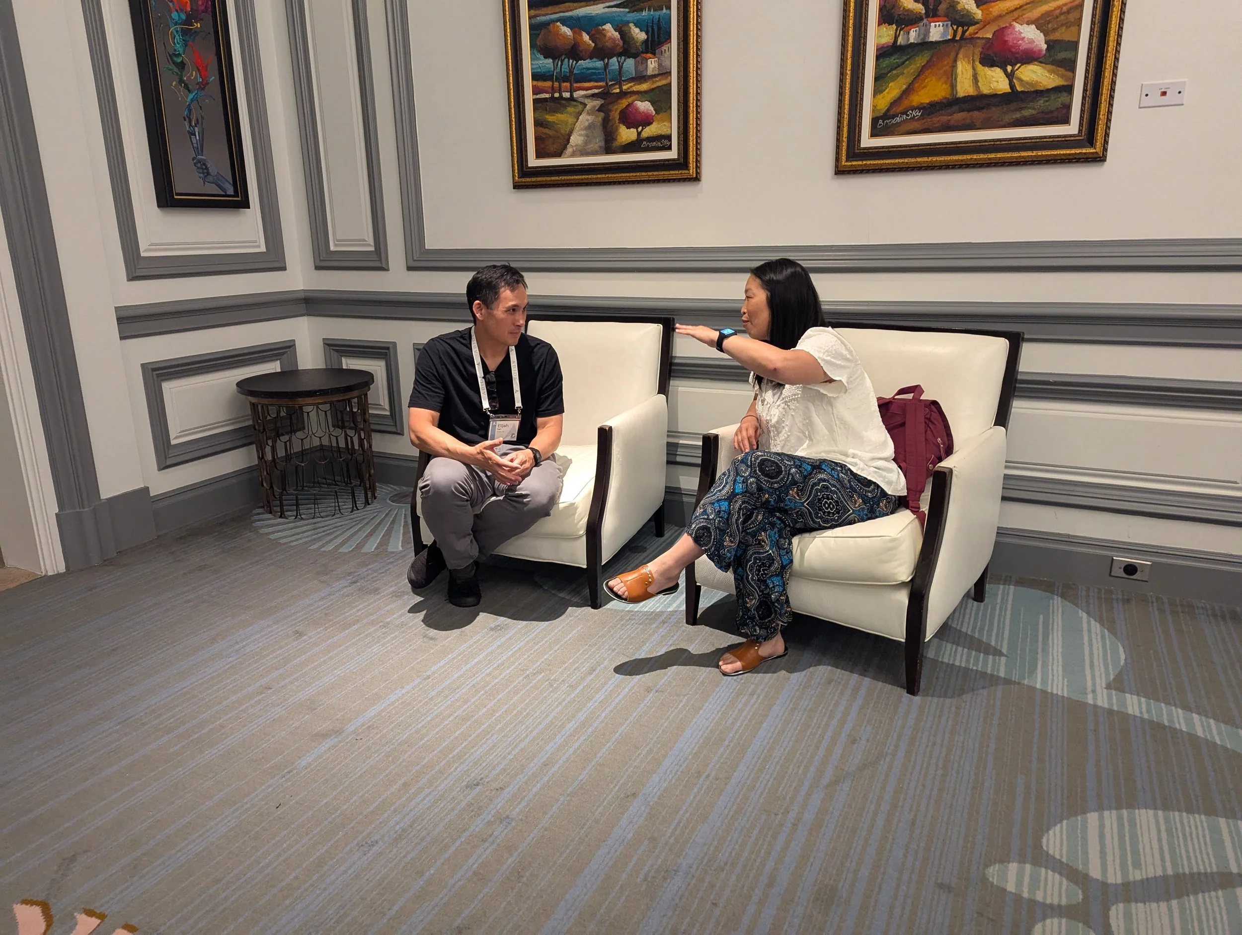 ag25-talking-in-hallway.jpg