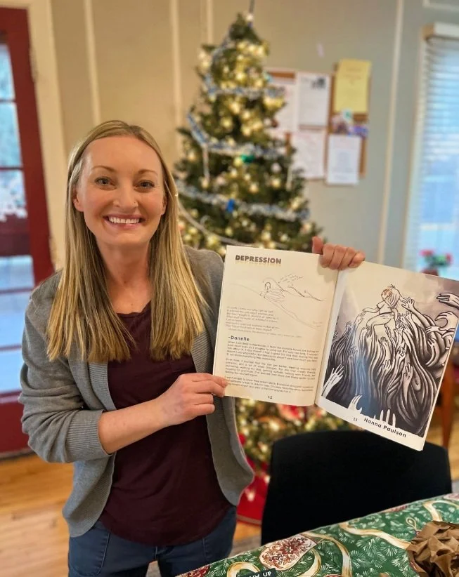 Danelle Holding Book.jpg
