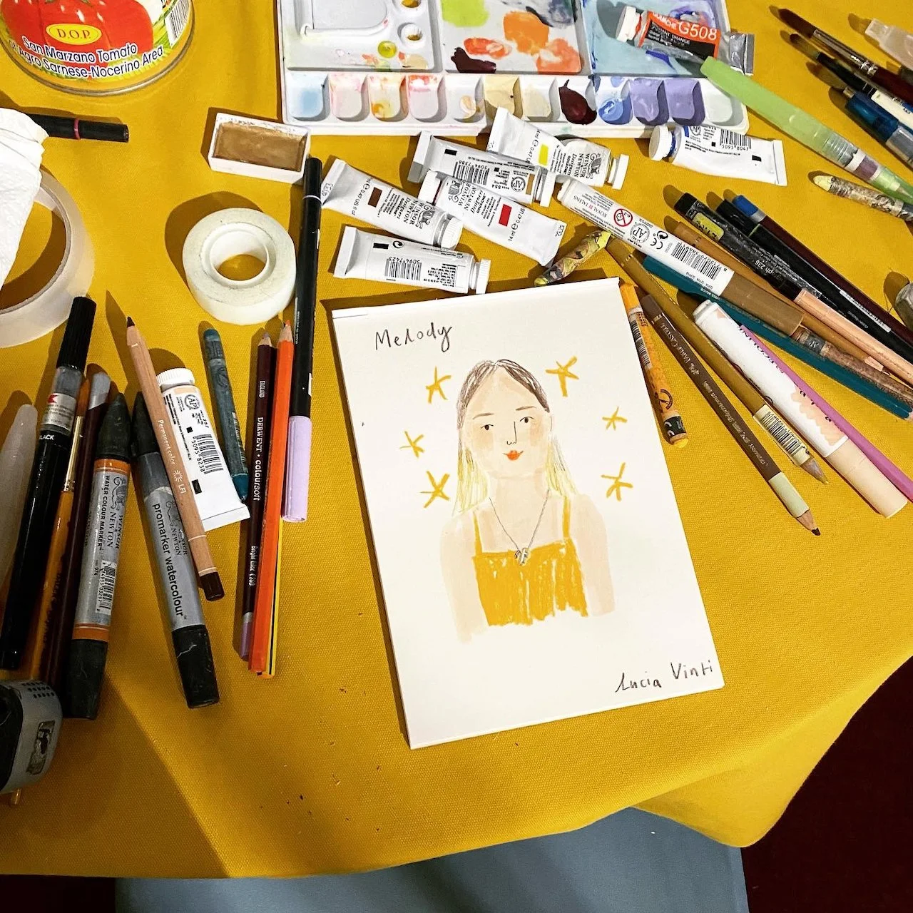 live portrait of girl on table with art supplies