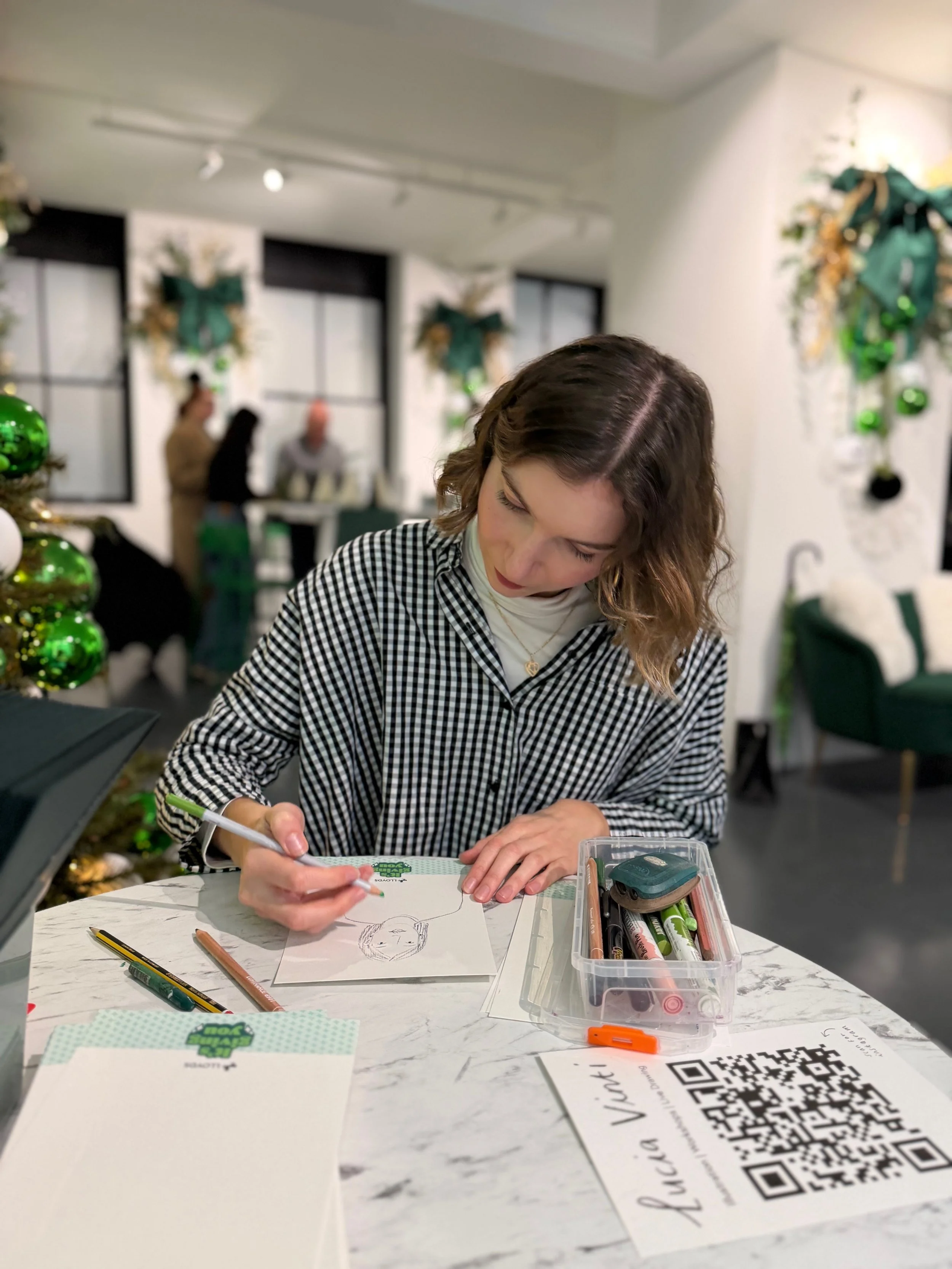 Drawing portraits at a christmas event