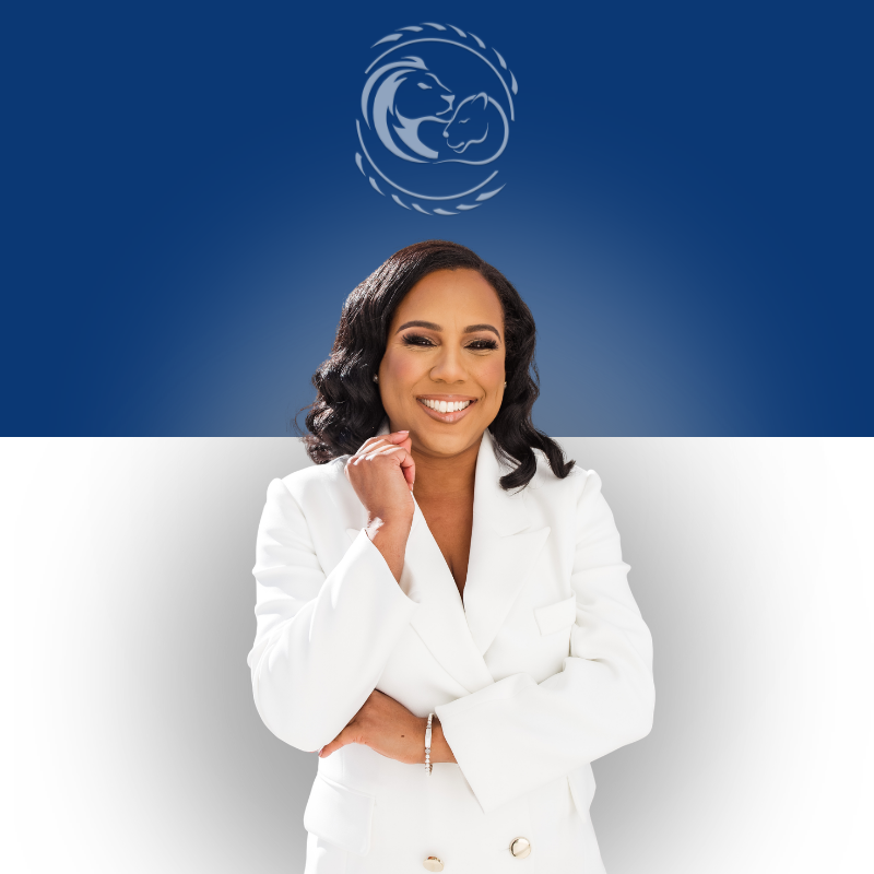 Smiling woman with long dark hair wearing a white suit.