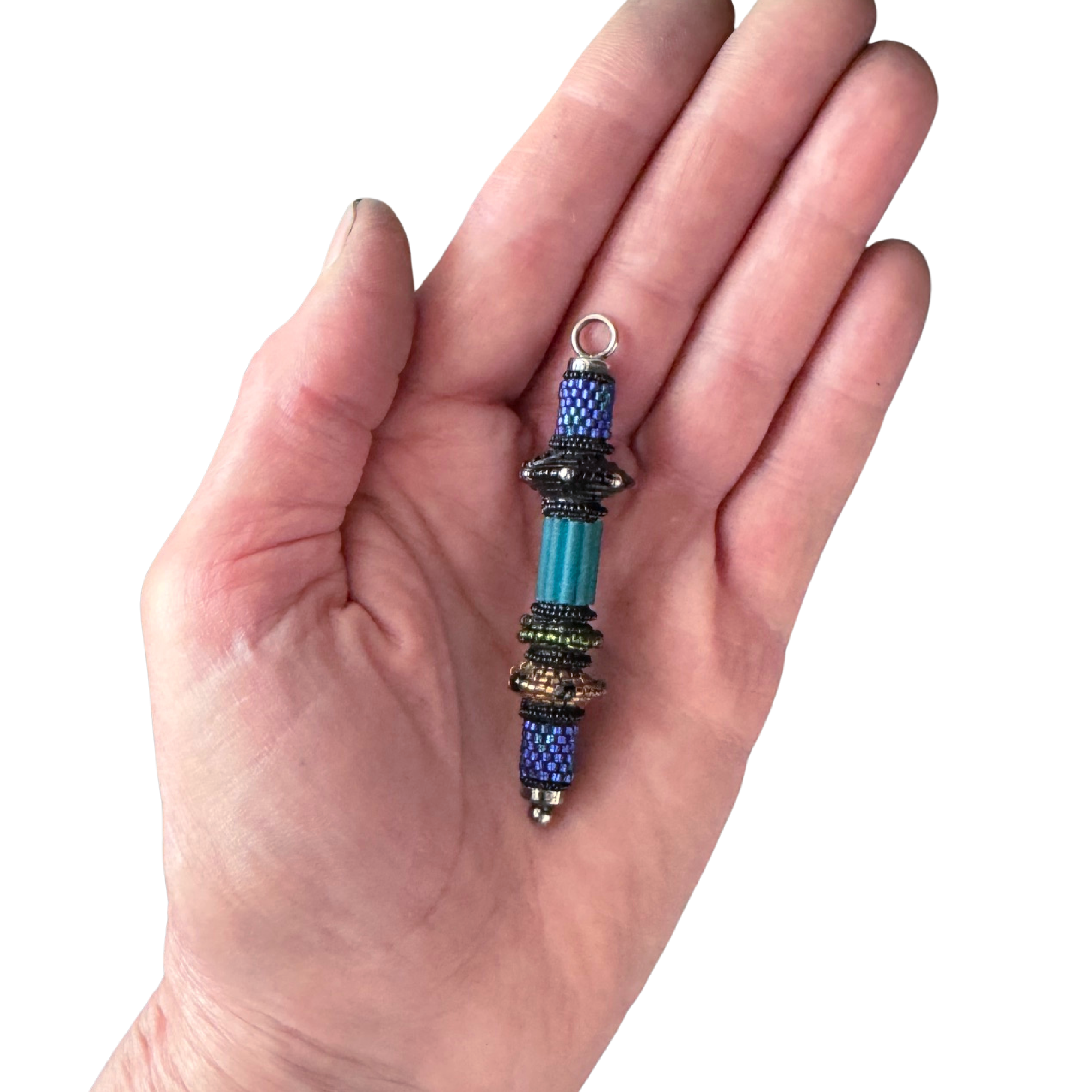 Vintage Small Sapphire Cylinder Pendant in Hand Image.png