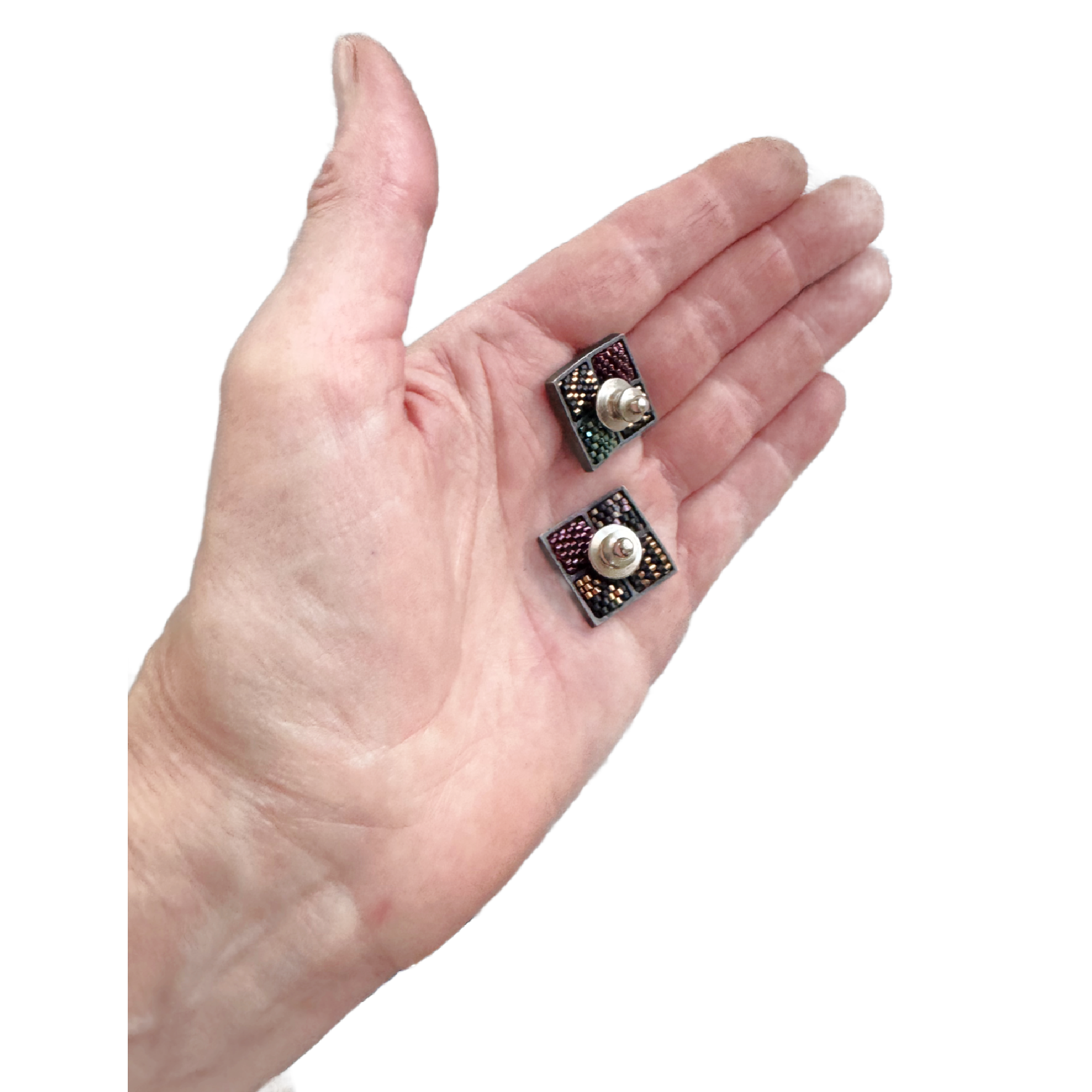 Two Confetti Label Pins in Hand.png