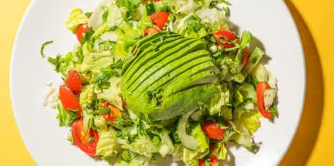 Fresh avocado salad with greens and vegetables from Empanada Mama.