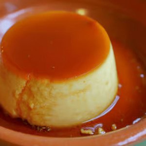 Creamy homemade flan topped with caramel sauce from Empanada Mama.