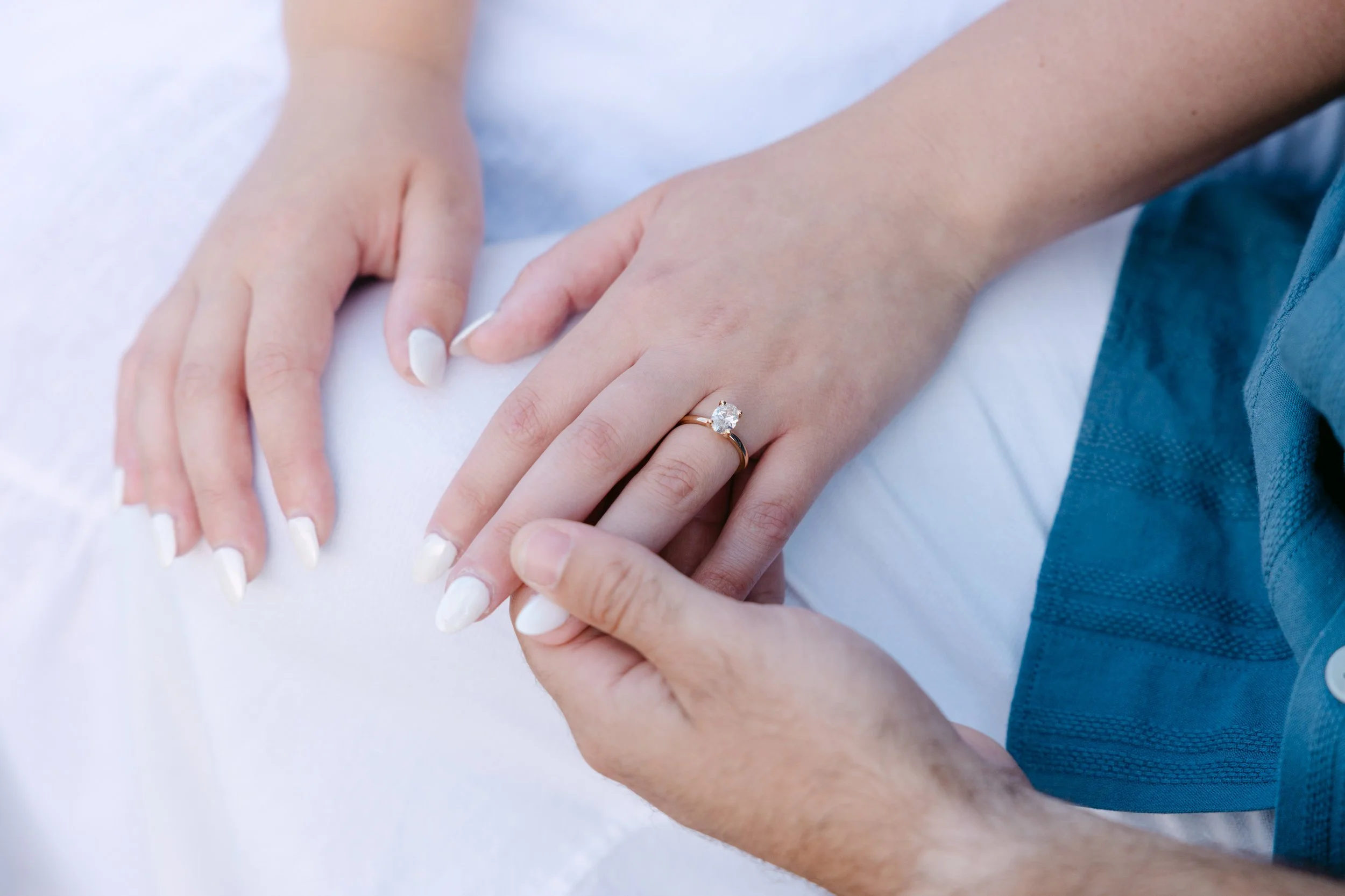 Close-up of an engagement ring during a short surprise proposal session in Lisbon.
