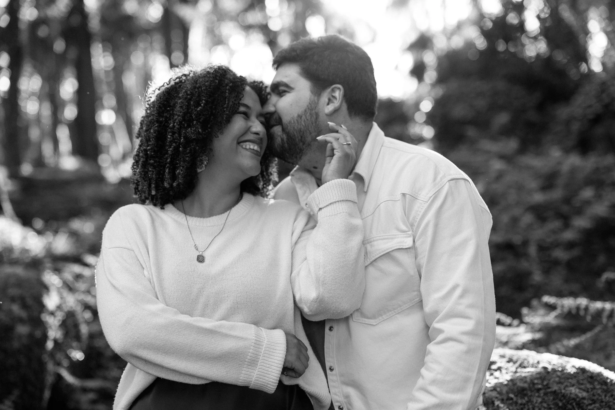 Black and white engagement portrait of couple in Sintra forest