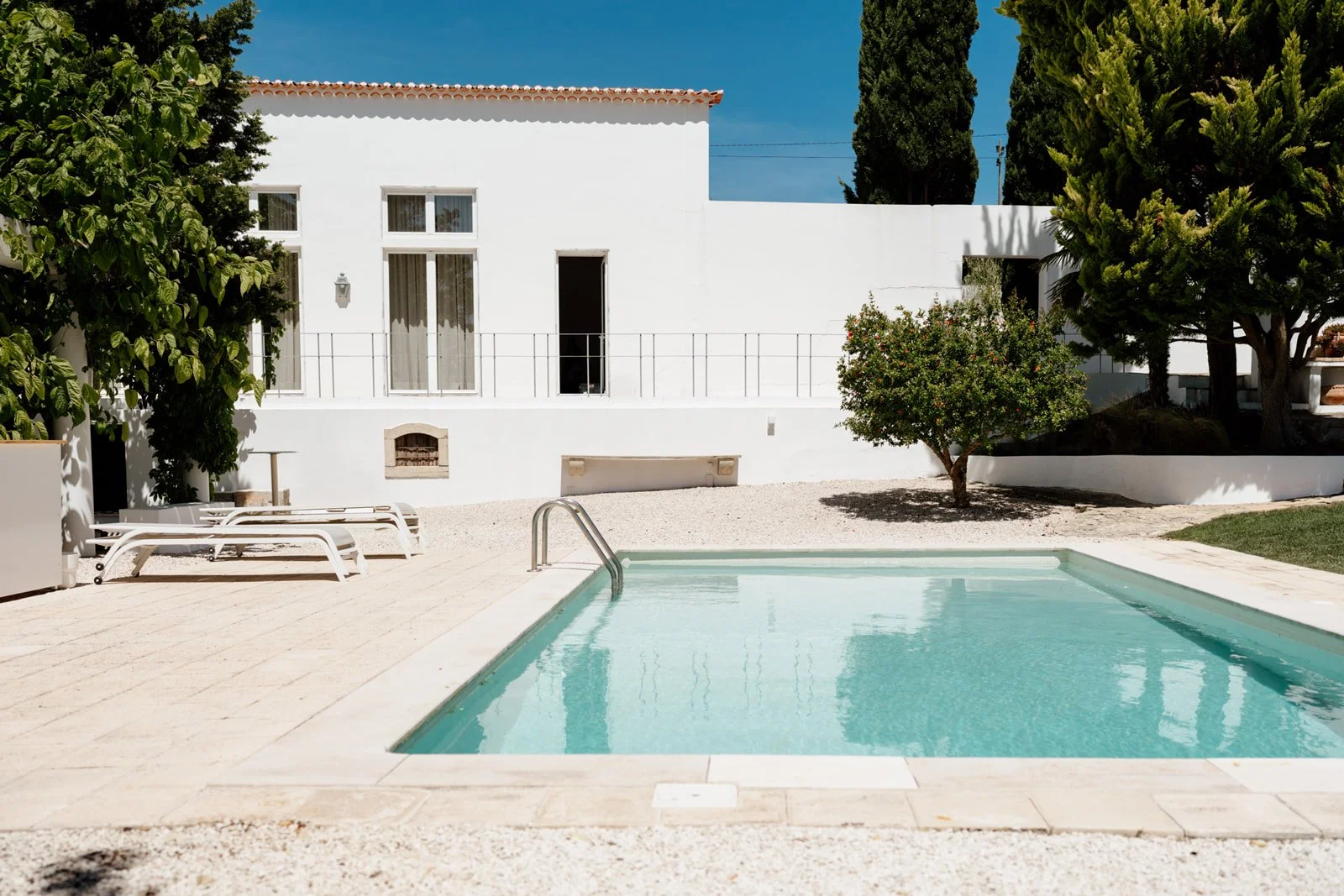 Luxury Portugal wedding venue Casa Sacoto with white architecture and pool courtyard