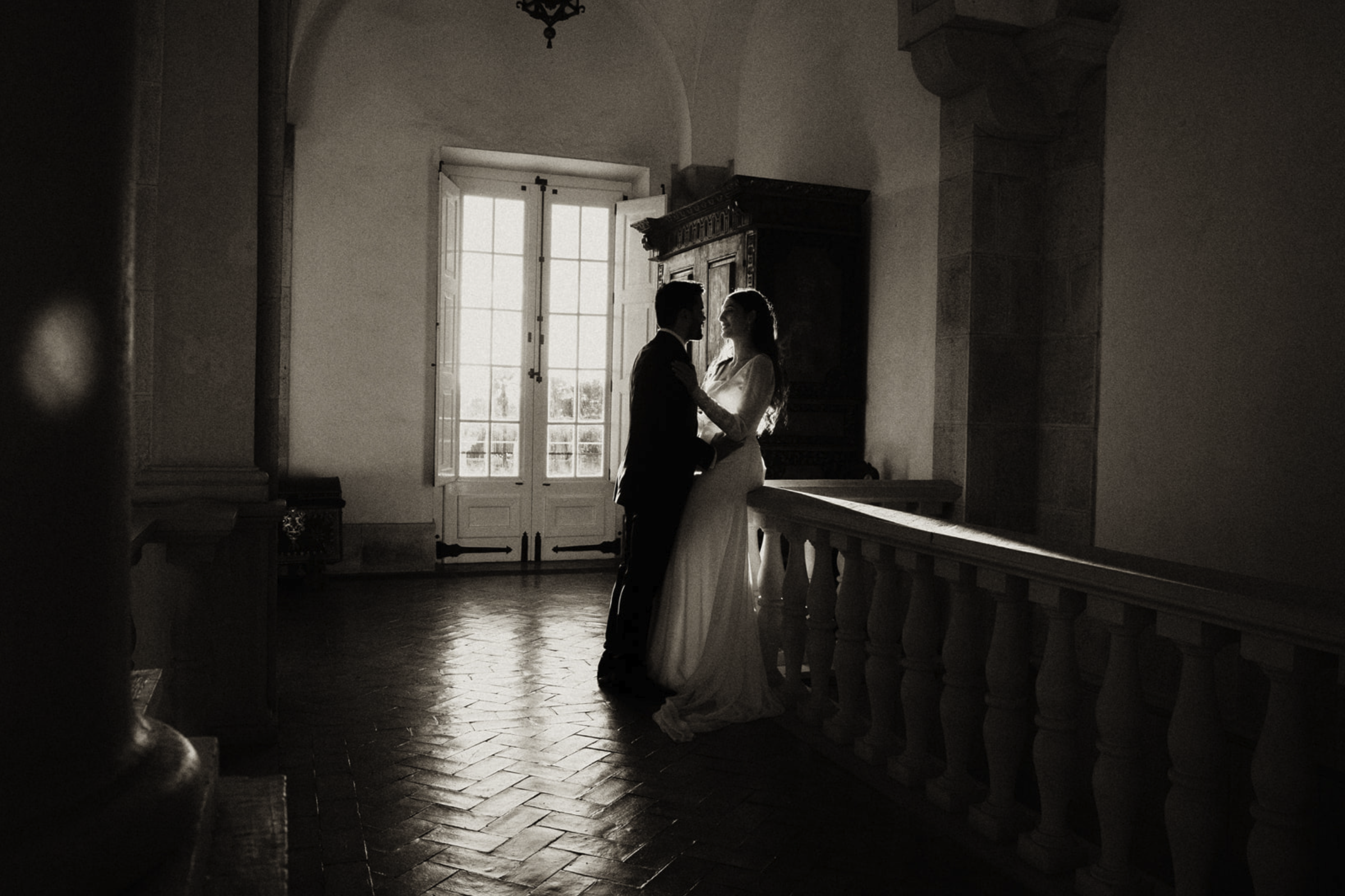 Romantic black and white portrait of bride and groom at historic wedding venue sao marcos palace in Portugal