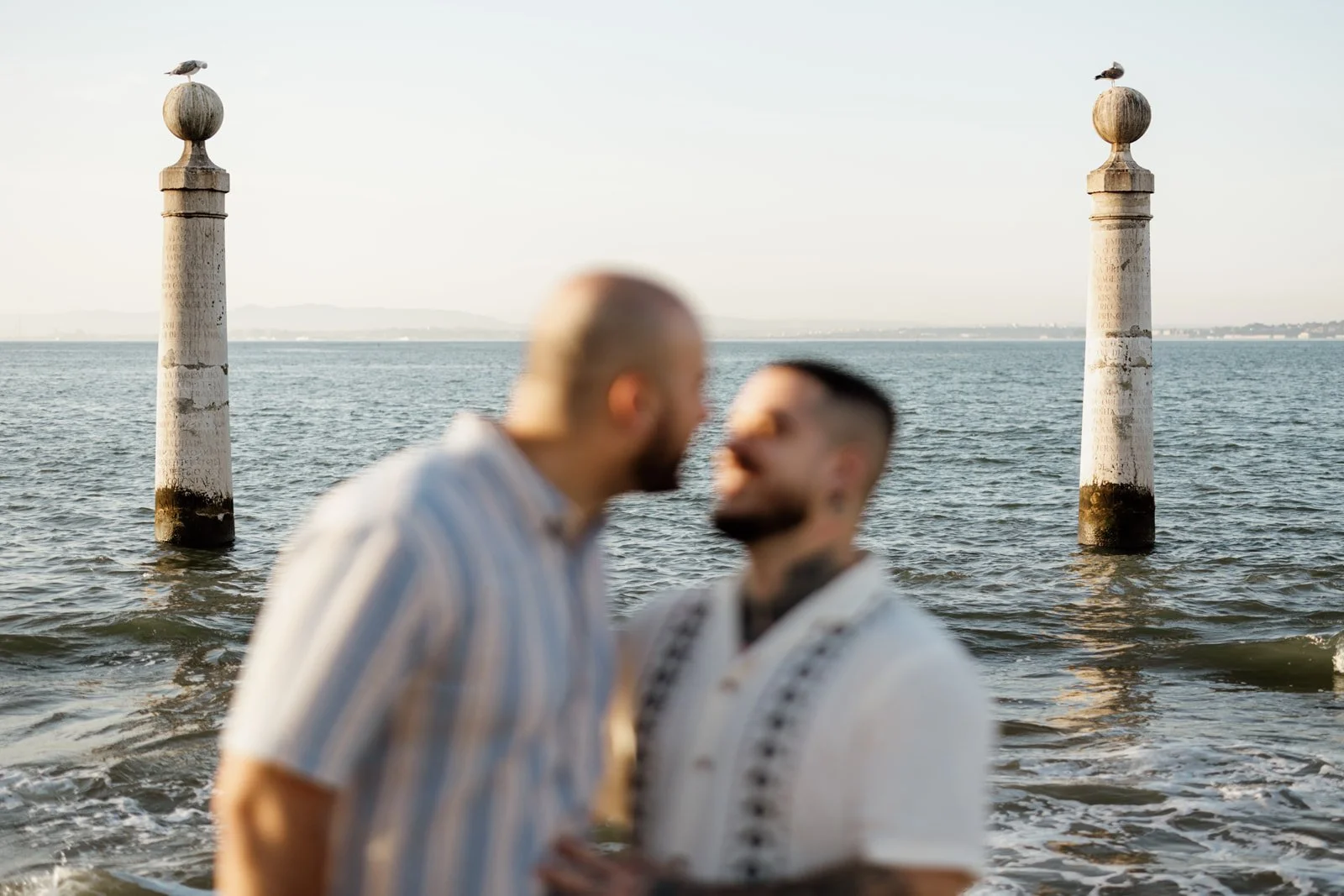Couple photographed at Cais das Colunas during an engagement session in Lisbon, Portugal.