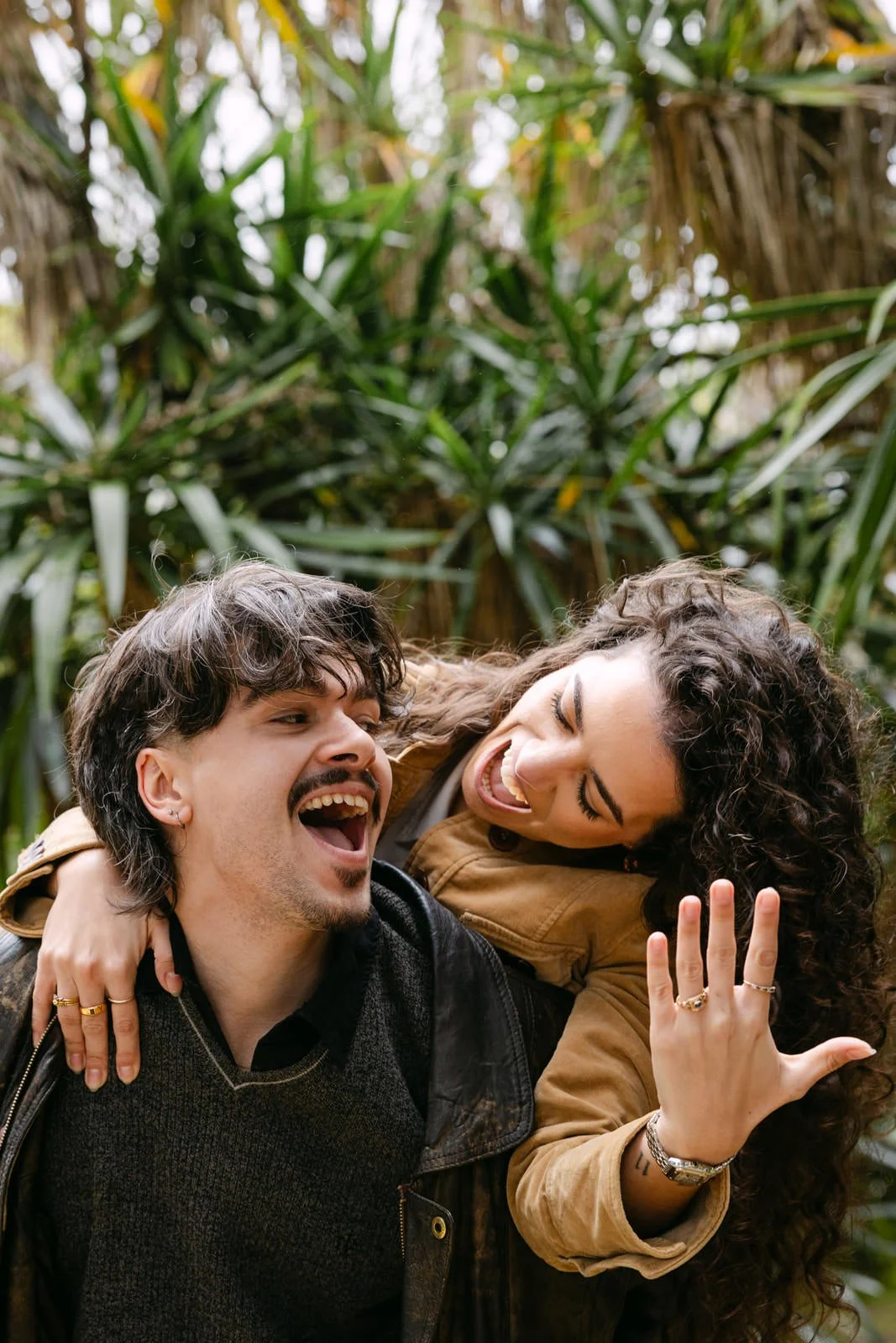 Recently engaged couple celebrating at Tapada das Necessidades gardens in Lisbon