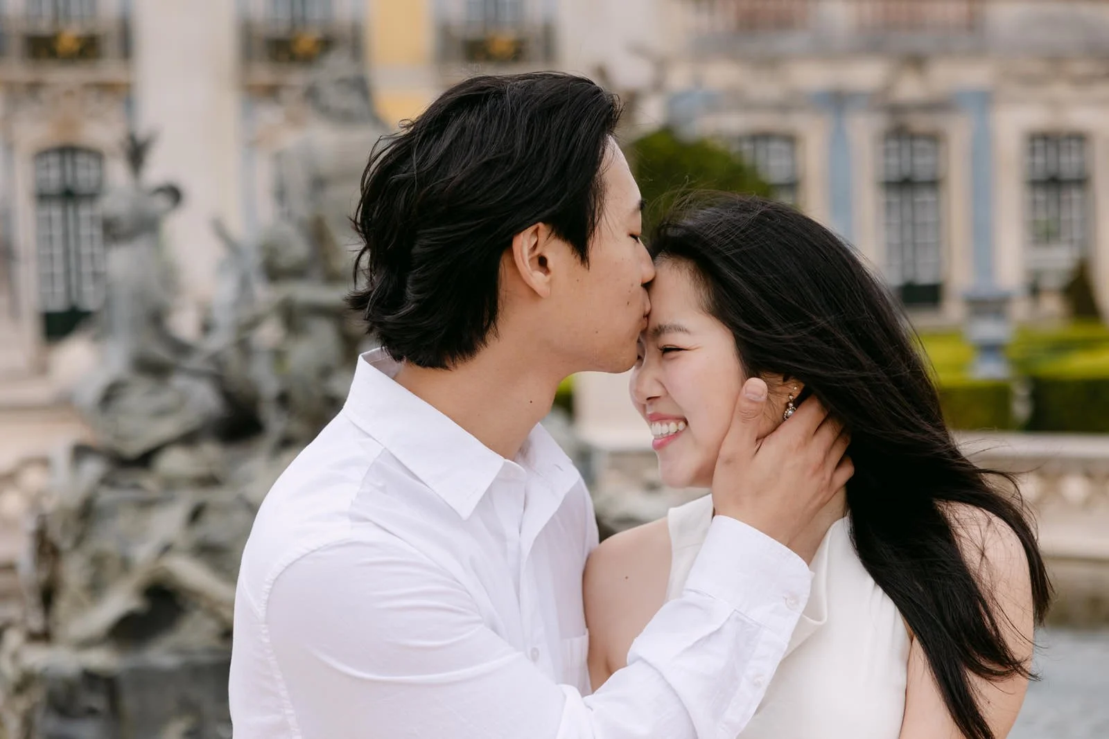 Romantic engagement photos of a Canadian couple at Palácio de Queluz in Portugal.