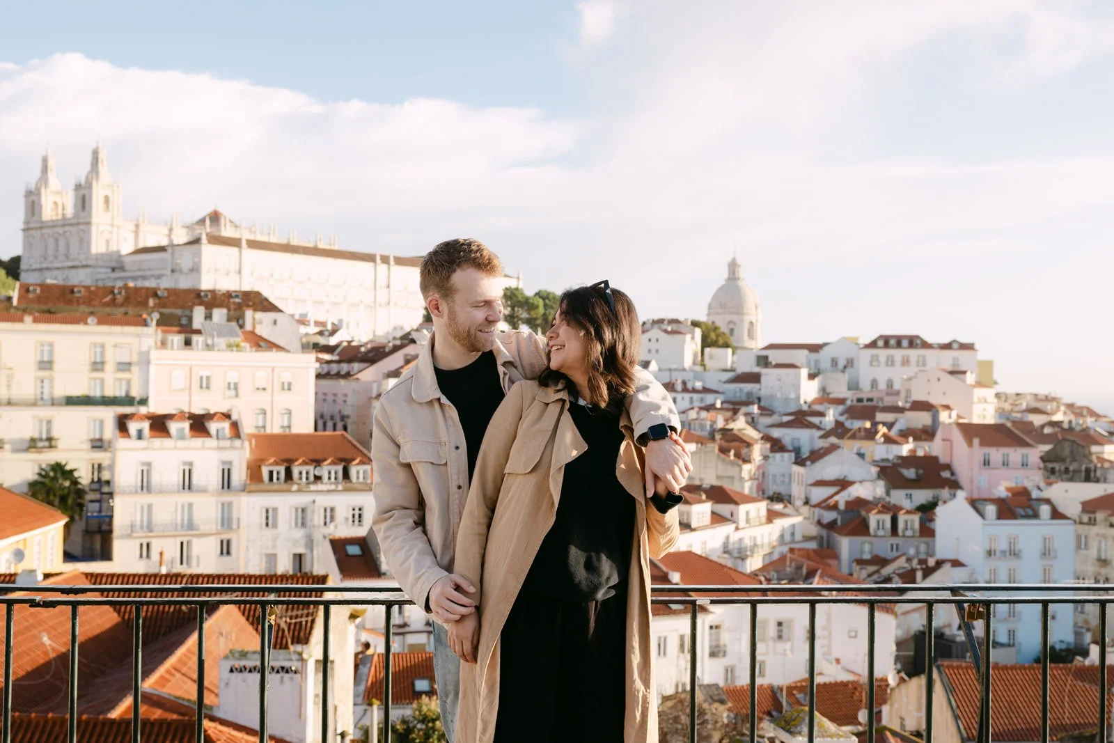 Couple celebrating their engagement at Portas do Sol viewpoint in Lisbon