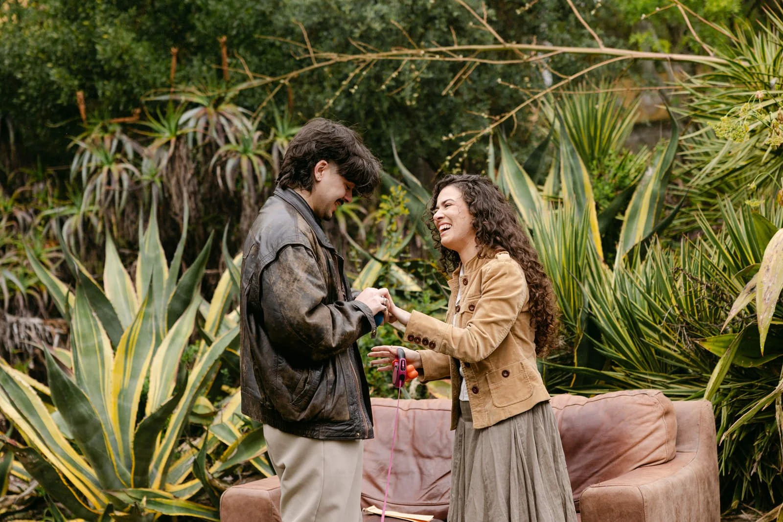 Antonio placing the engagement ring on Serena's finger