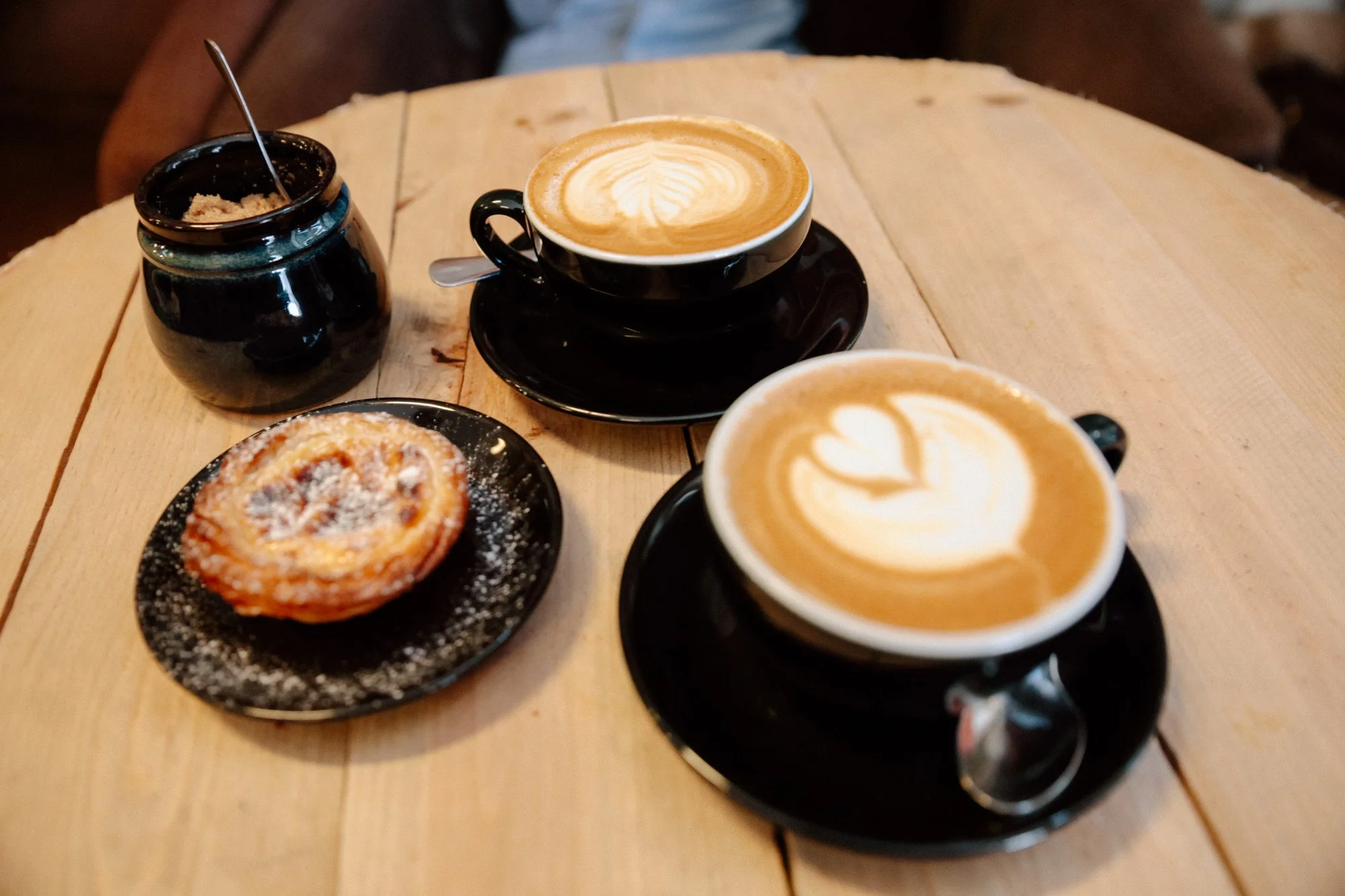 Coffee and pastel de nata at a local café in Lisbon Portugal