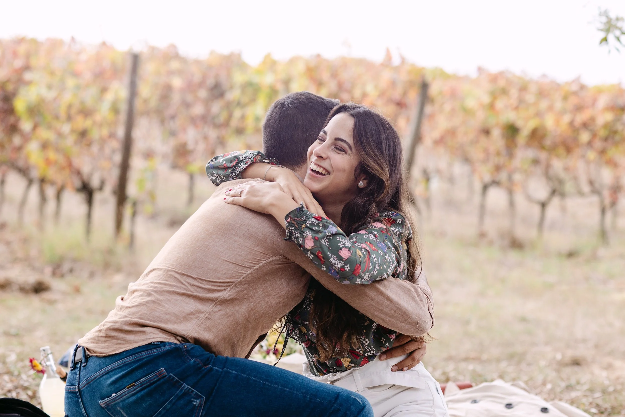 couple hugging after surprise proposal at Quinta de Santana