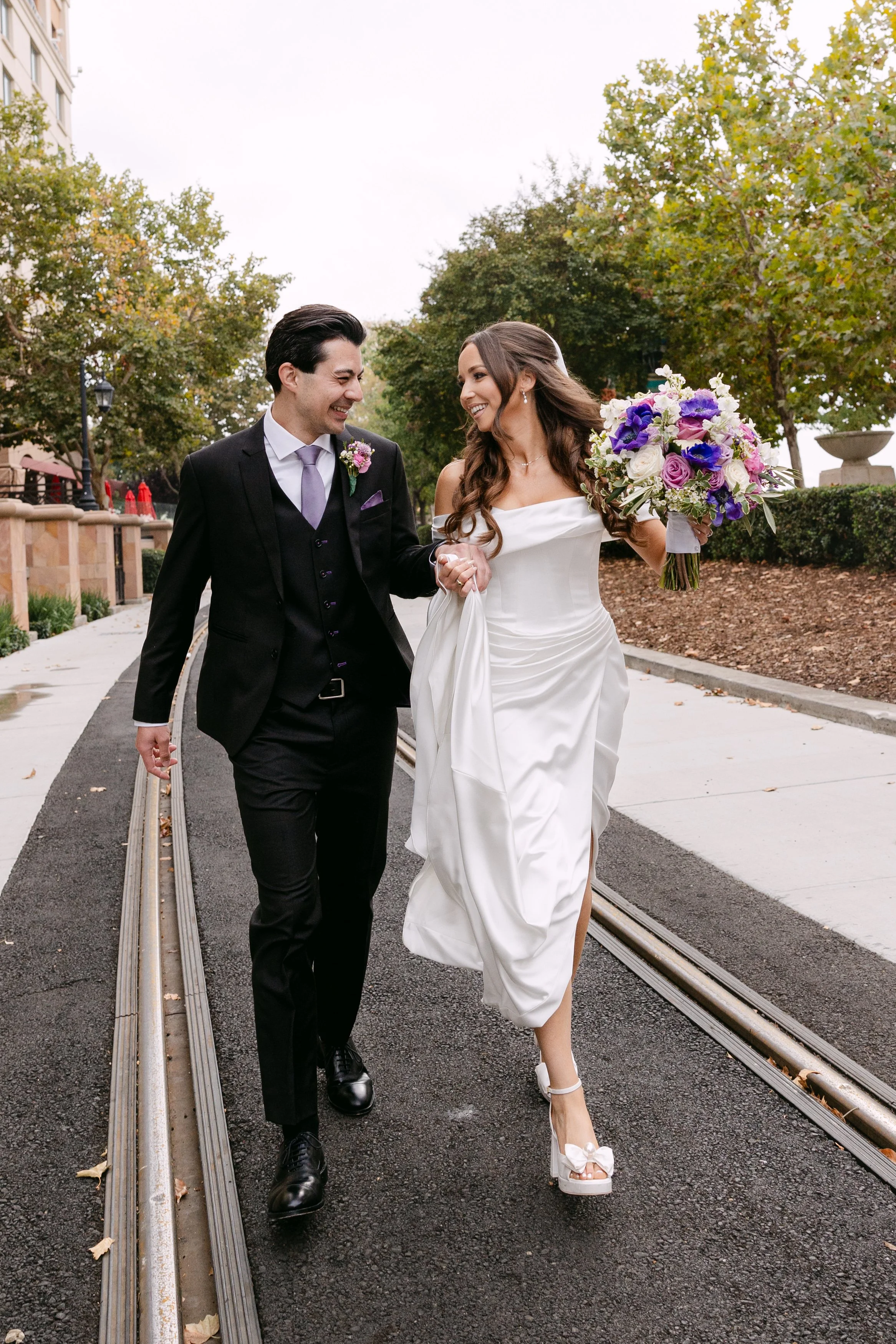 Documentary wedding photography, bride and groom walking together on their wedding day