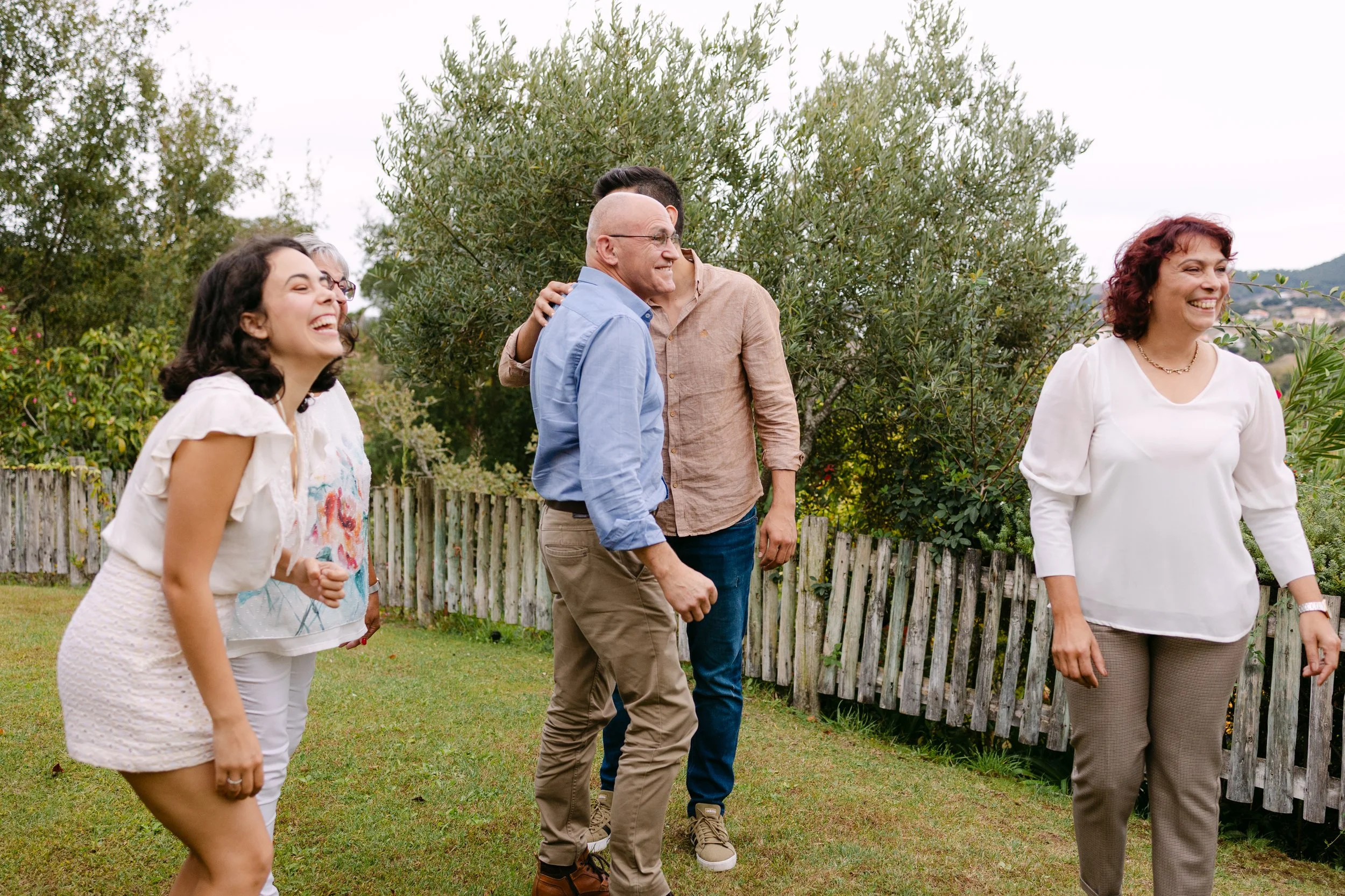 Family surprising newly engaged couple after vineyard proposal in Portugal