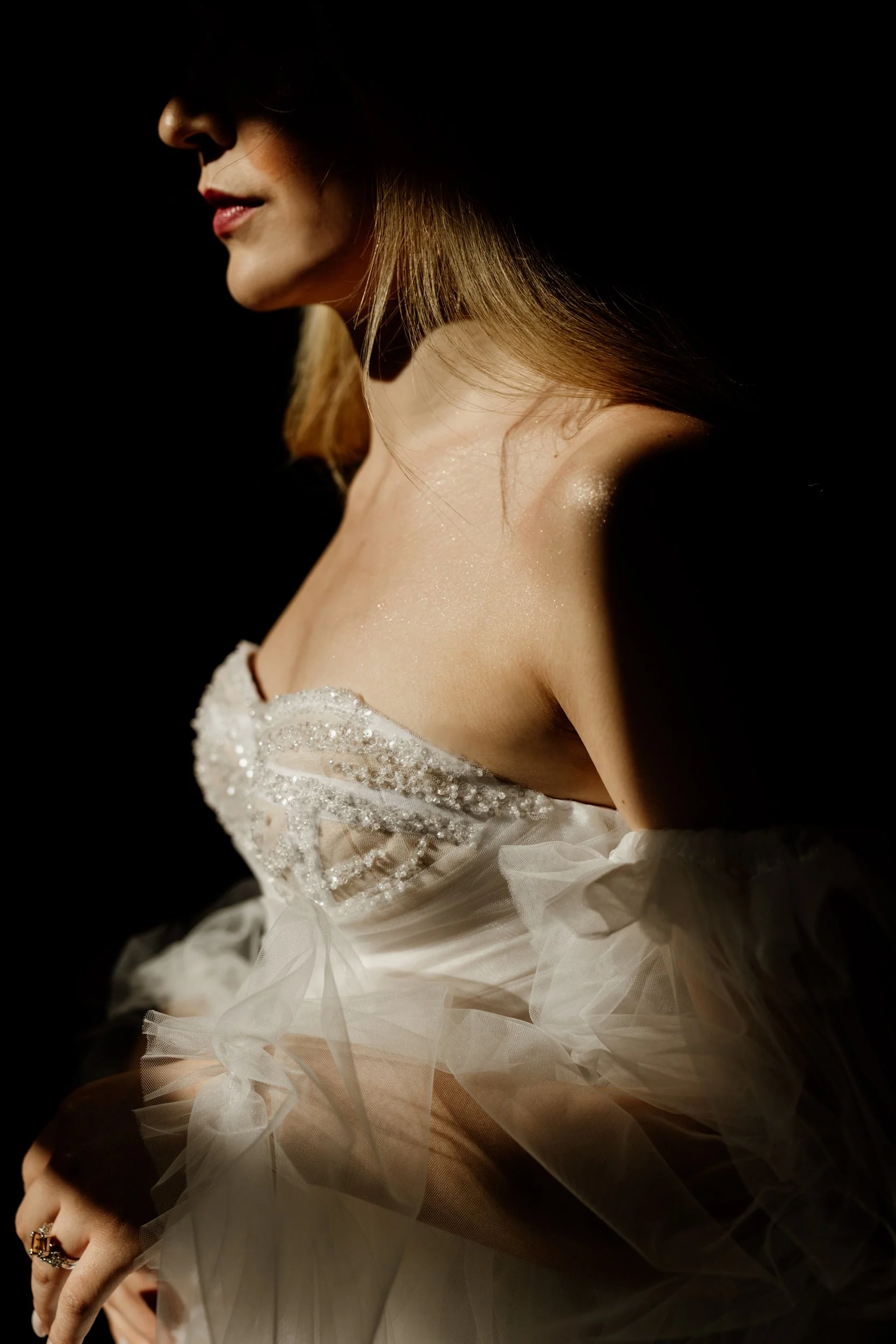 Elegant bridal portrait showing wedding dress details in editorial style