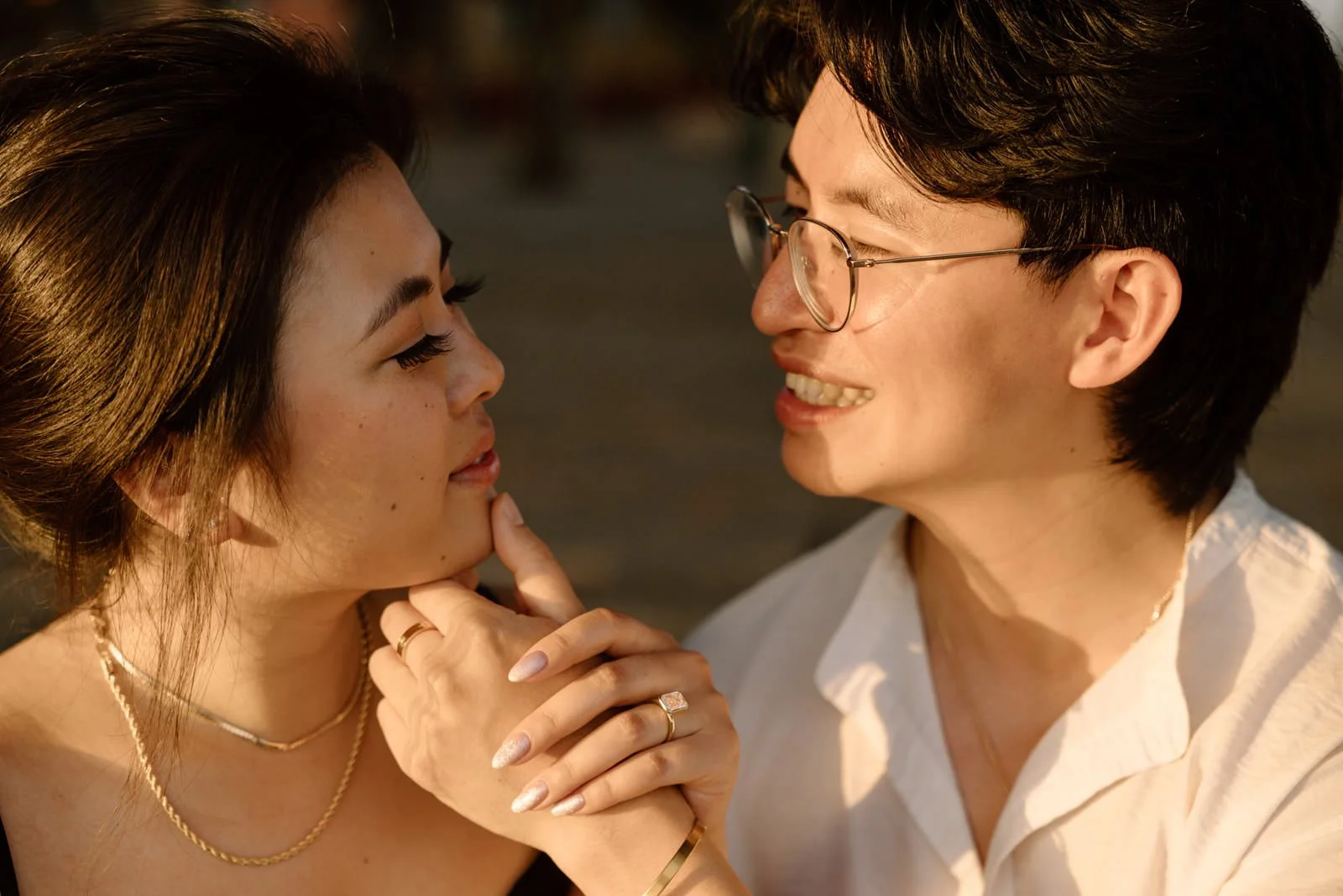 Romantic engagement portraits at Castelo de São Jorge overlooking Lisbon during sunset.