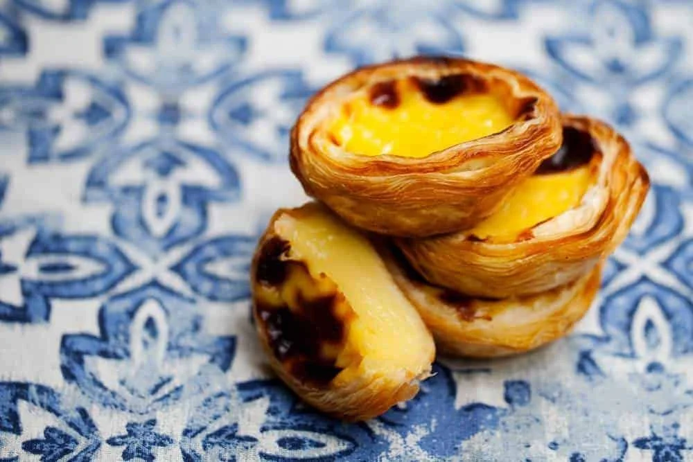 Traditional Pastéis de Belém pastries photographed during an engagement session in Lisbon, Portugal.