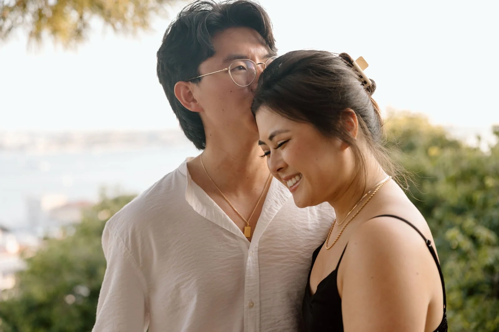 Romantic engagement portraits at Castelo de São Jorge overlooking Lisbon and the Tagus River.