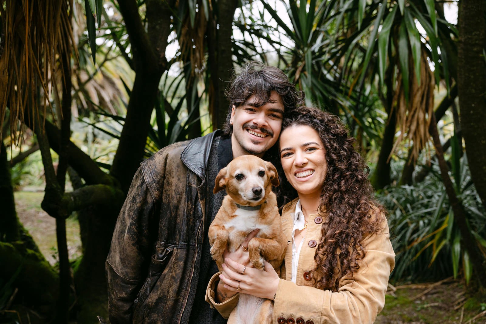 Engaged couple with their dog Kinder during an engagement session at Tapada das Necessidades in Lisbon
