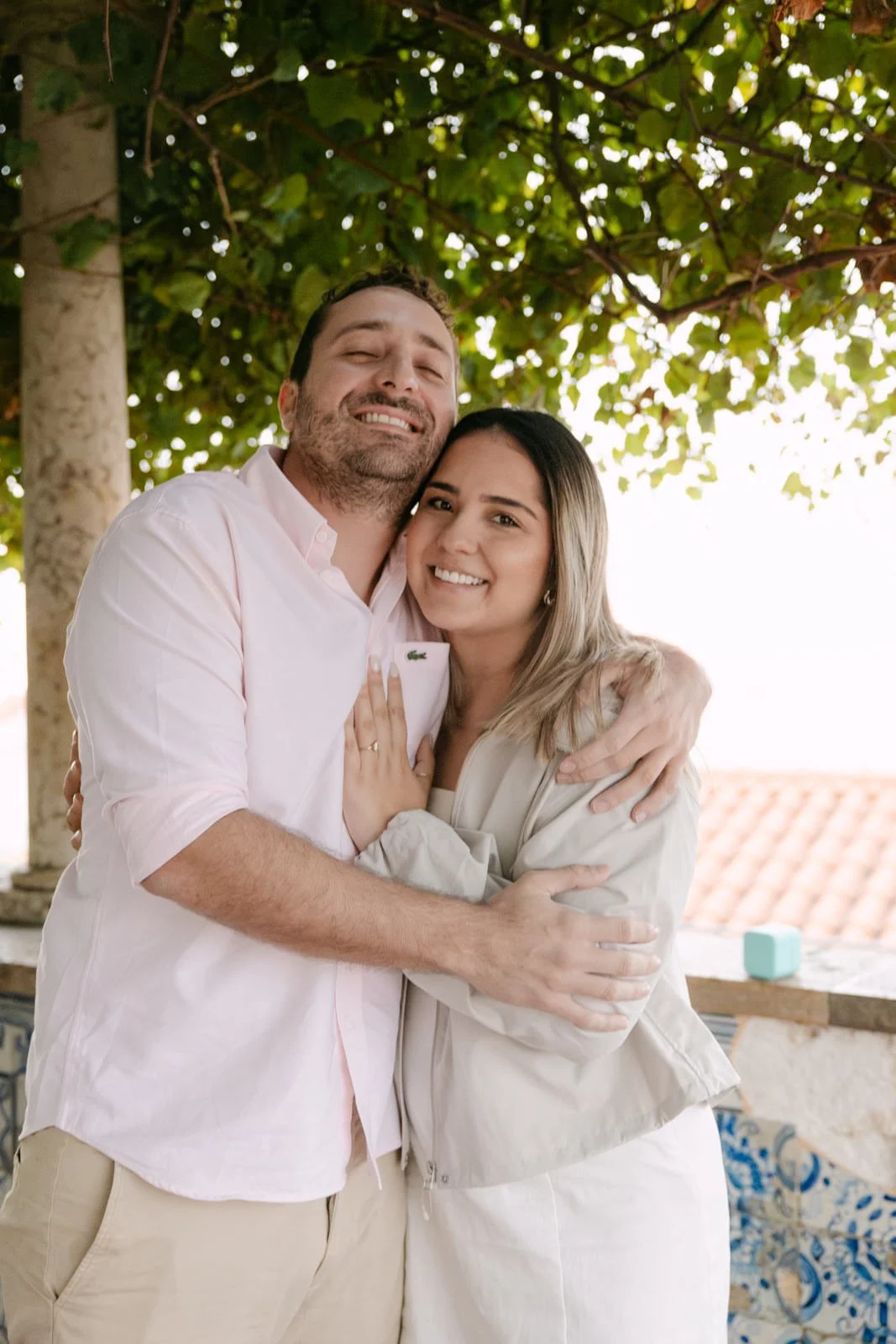 Close-up portrait featuring a two-stone engagement ring during a Lisbon proposal session
