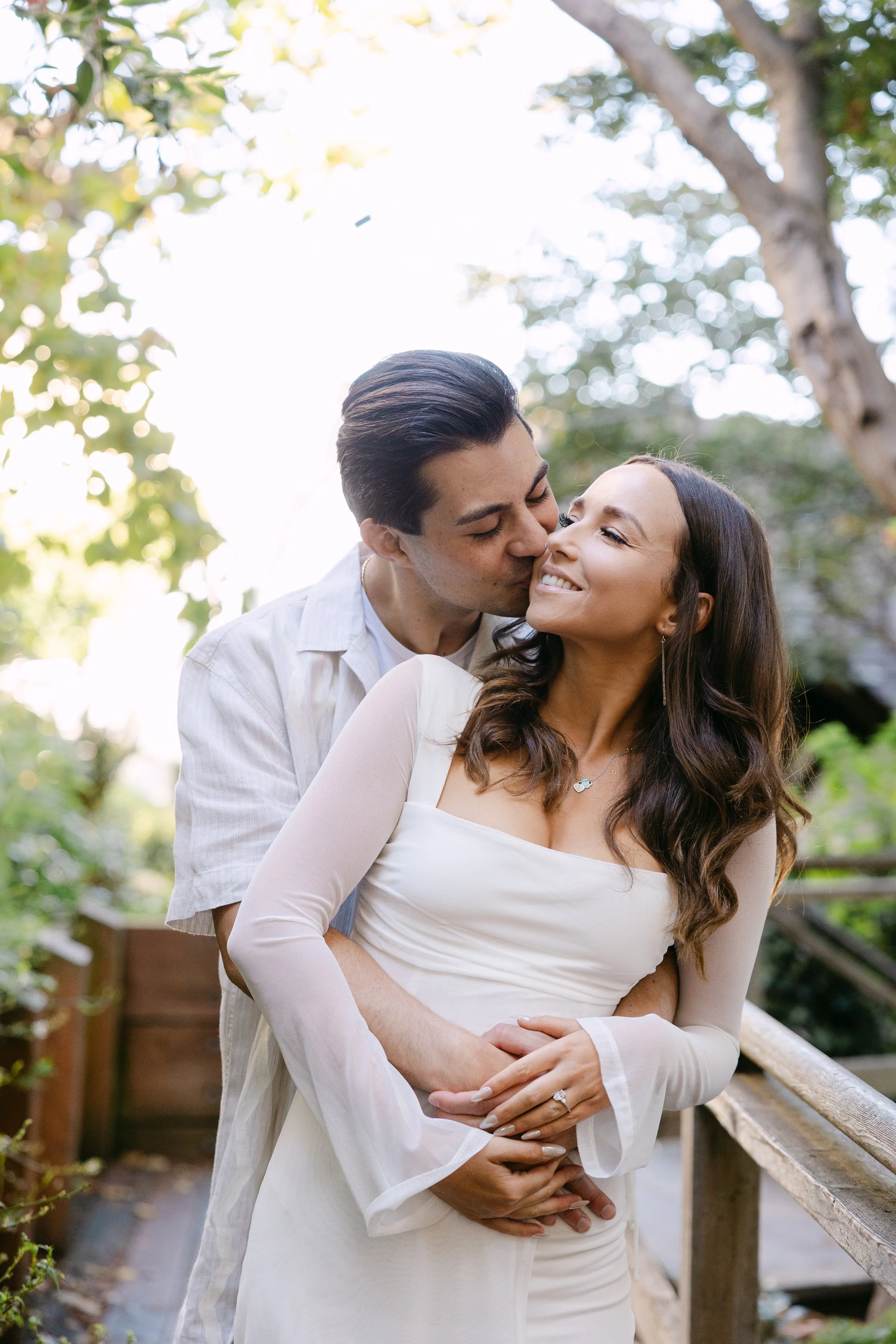 Intimate engagement session photography, couple sharing a tender moment