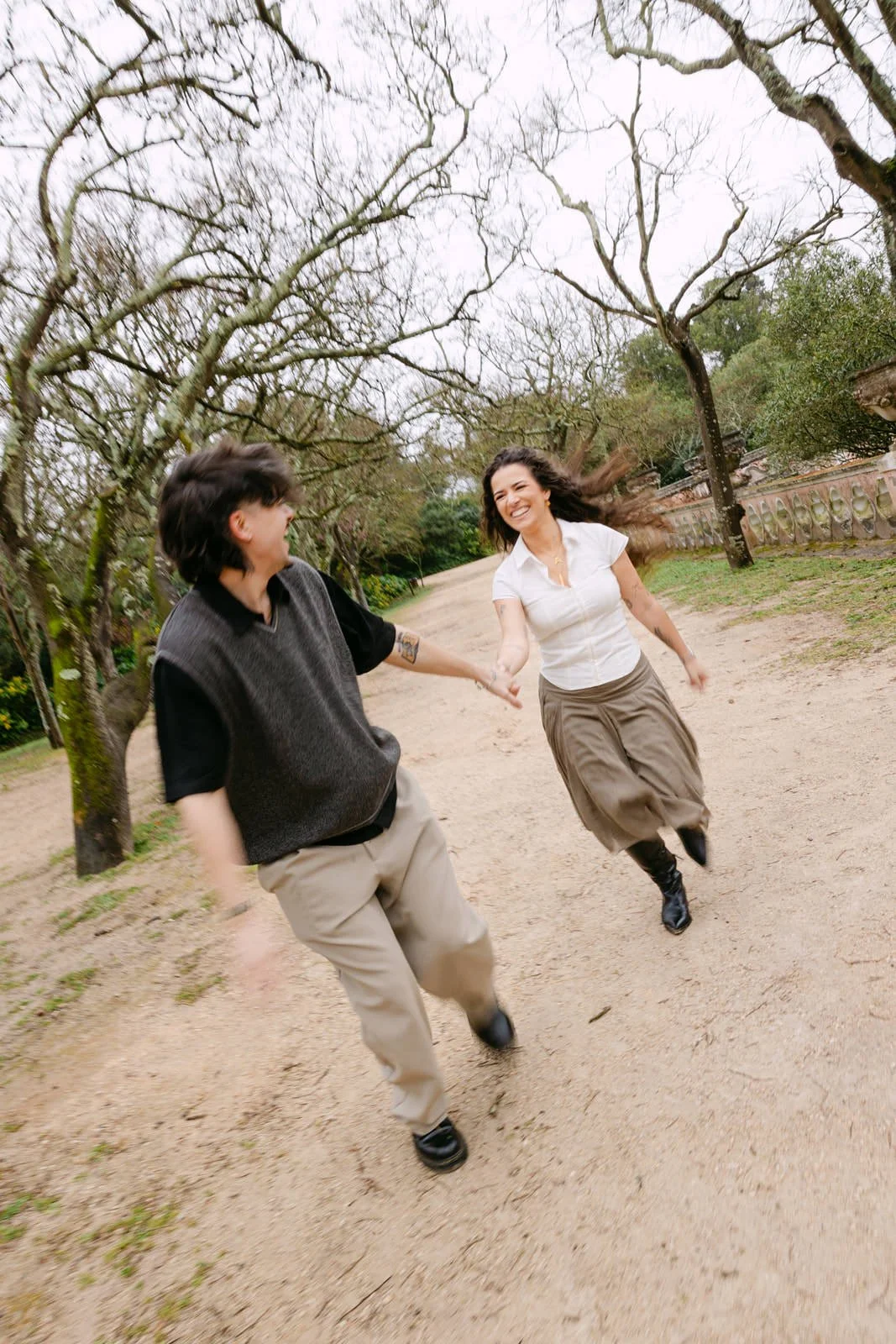 Playful engagement photos at Tapada das Necessidades in Lisbon