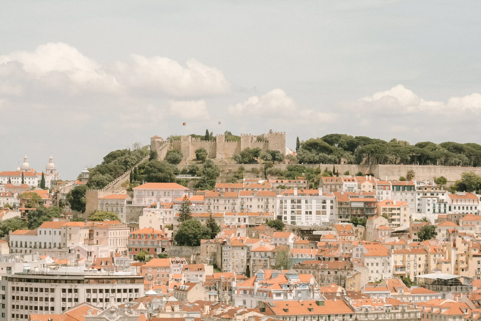 View over Castelo de São Jorge and historic Lisbon rooftops in Portugal