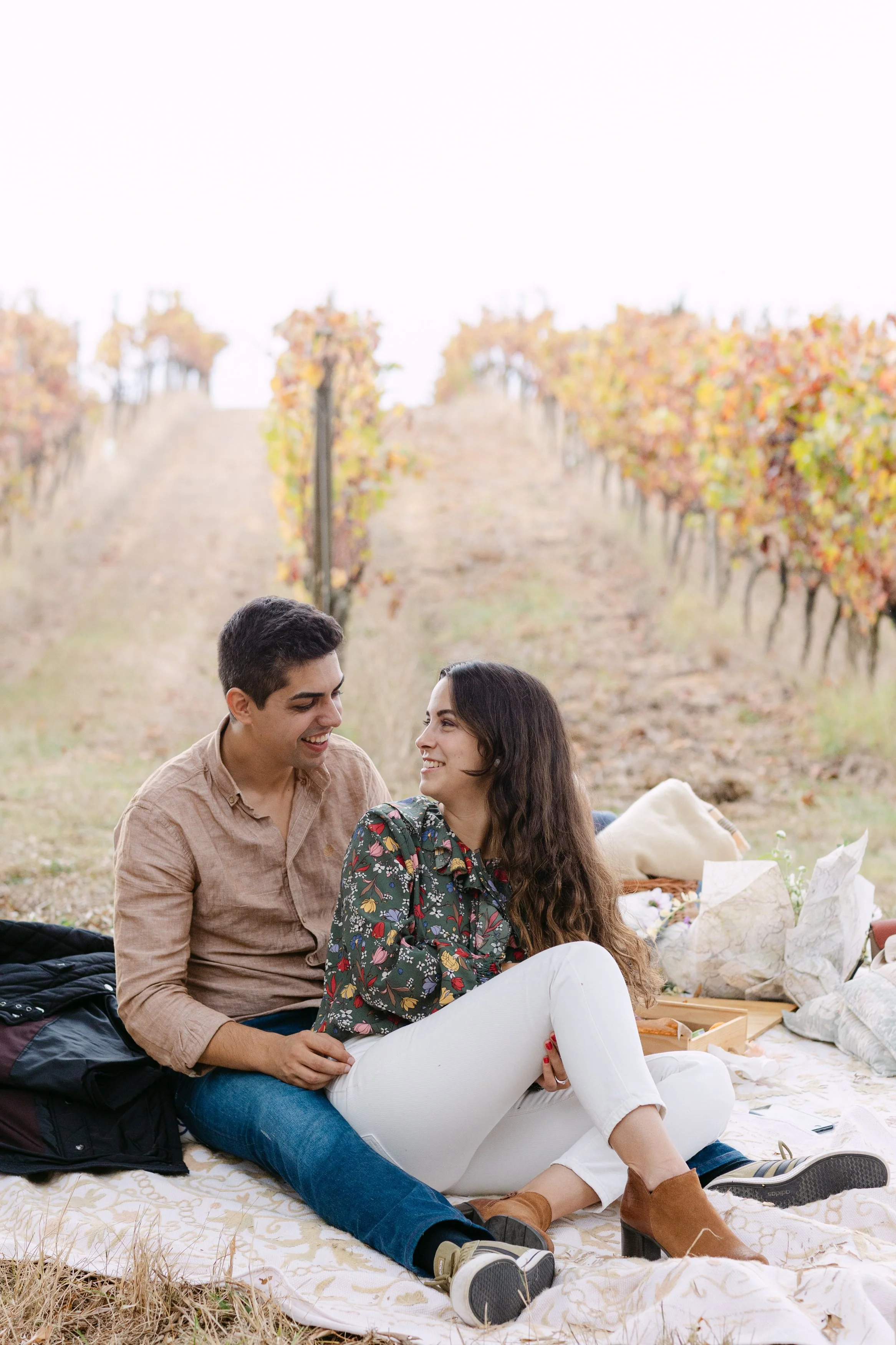 Couple smiling together during engagement session at Quinta de Santana