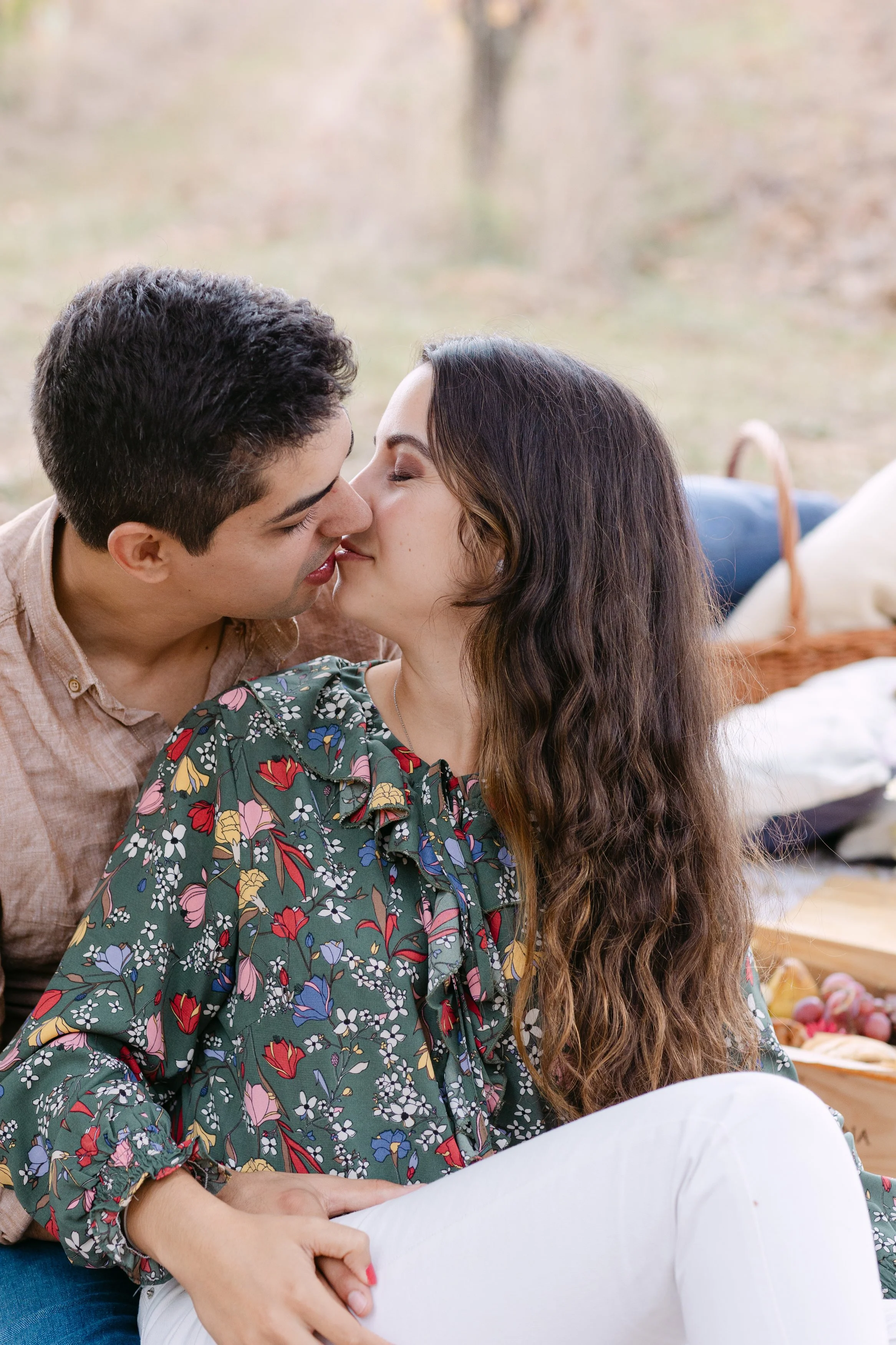 Couple kissing after romantic proposal in Portuguese vineyard