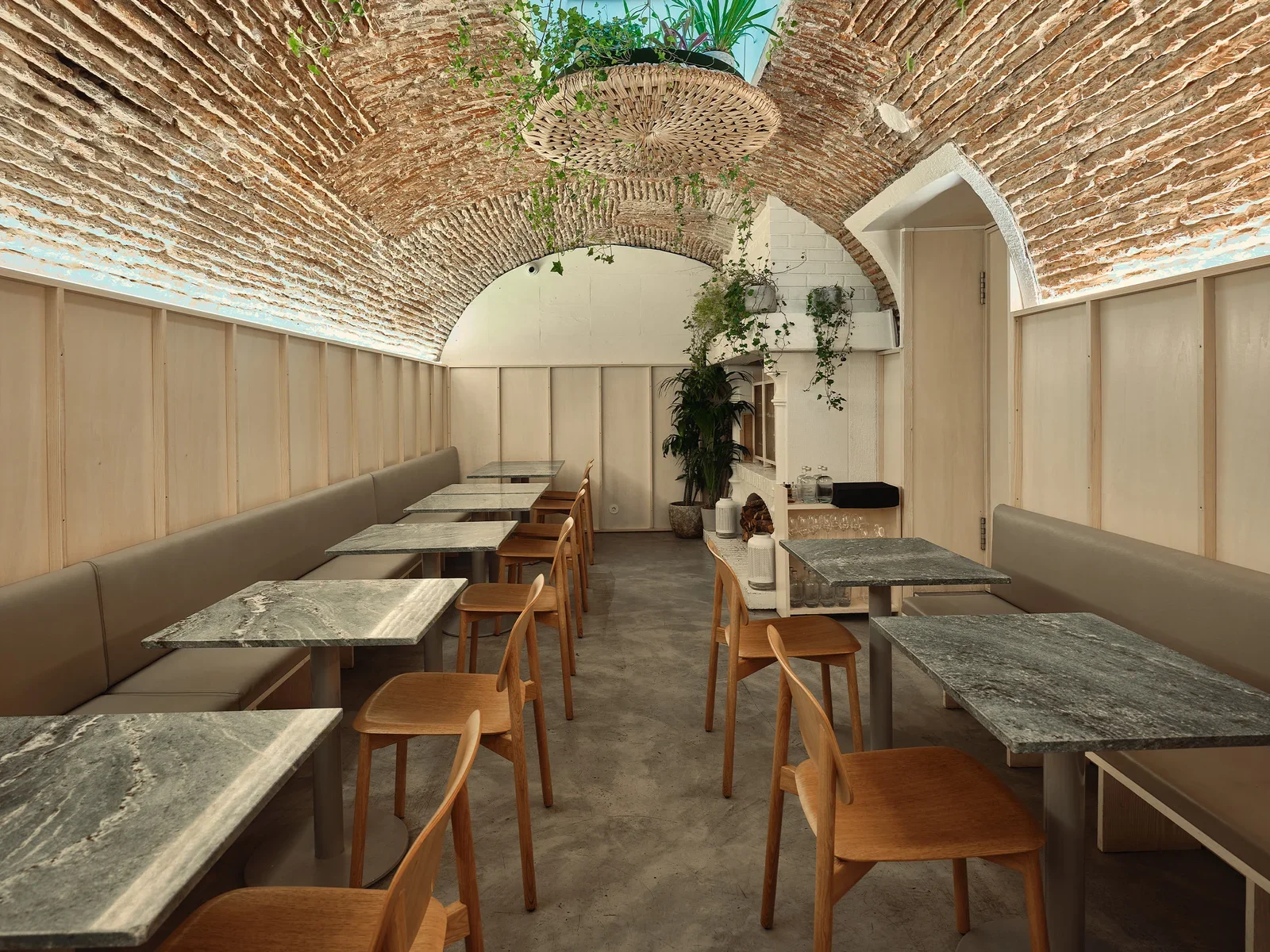 Plano restaurant interior in Lisbon Portugal with warm lighting and vaulted ceilings