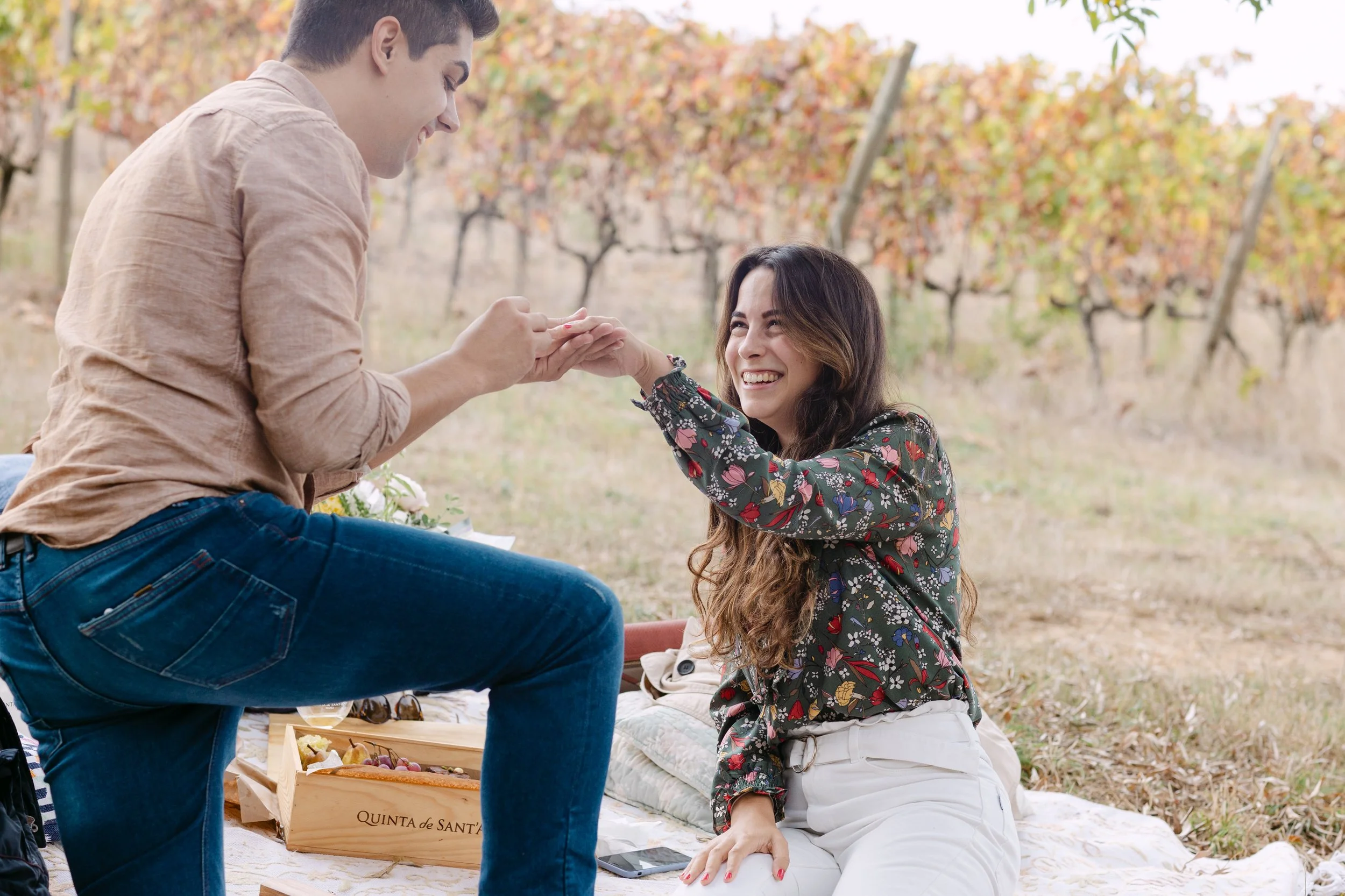 girl reacting emotionally during surprise proposal at Quinta de Santana vineyard