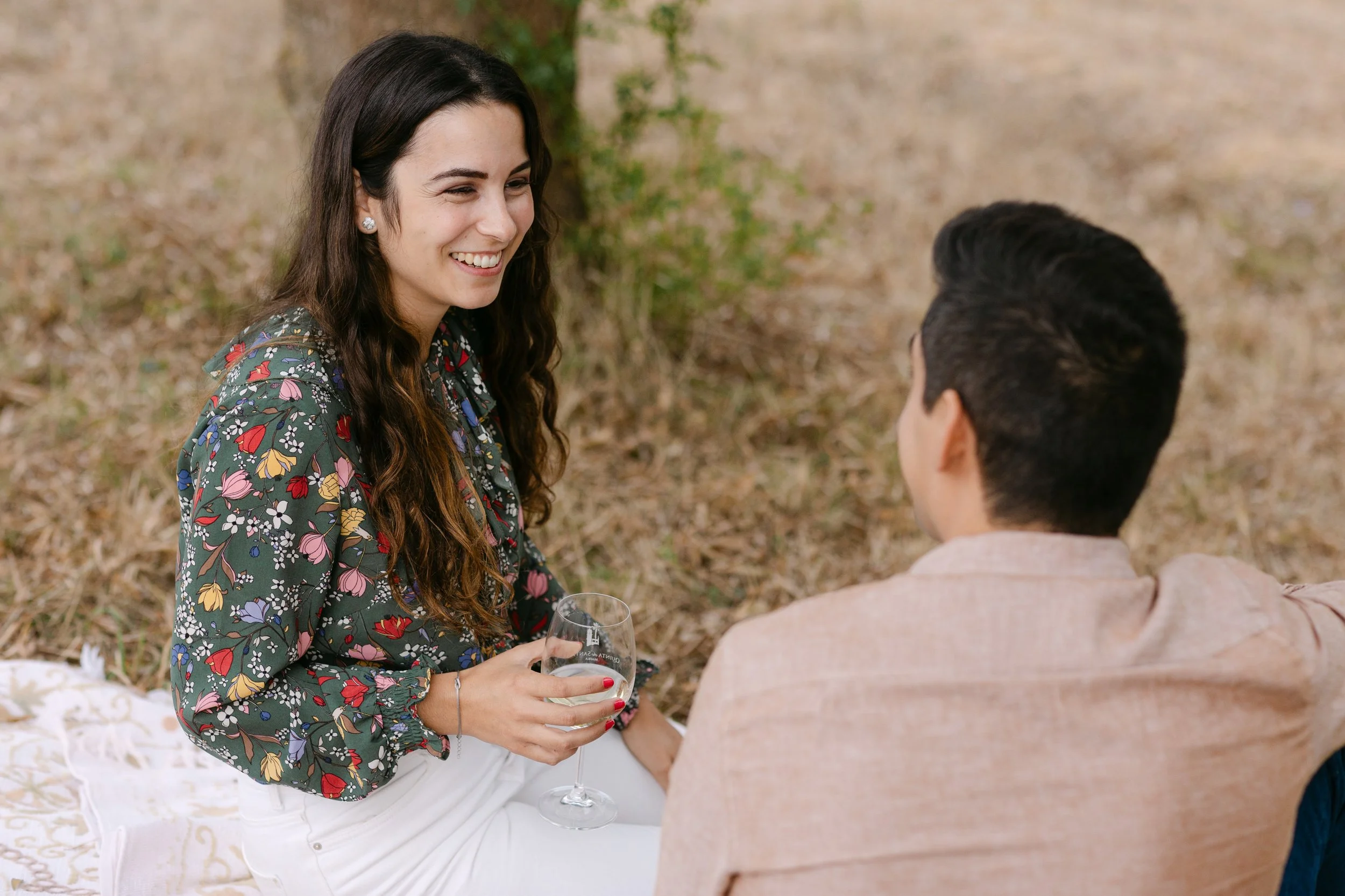 girl smiling emotionally moments after surprise proposal in Portugal