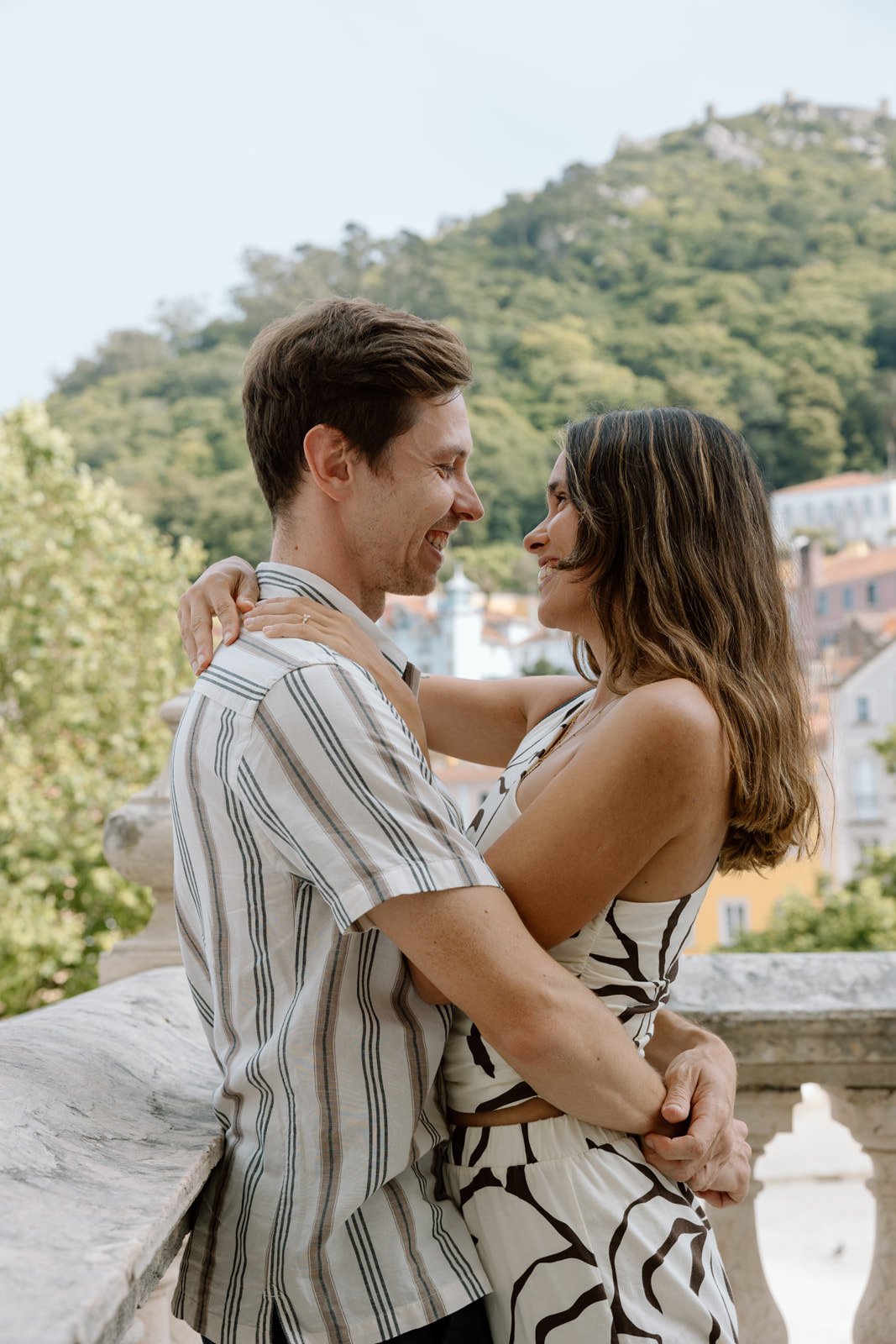 Romantic engagement portrait overlooking Sintra Village after a surprise proposal in Portugal.
