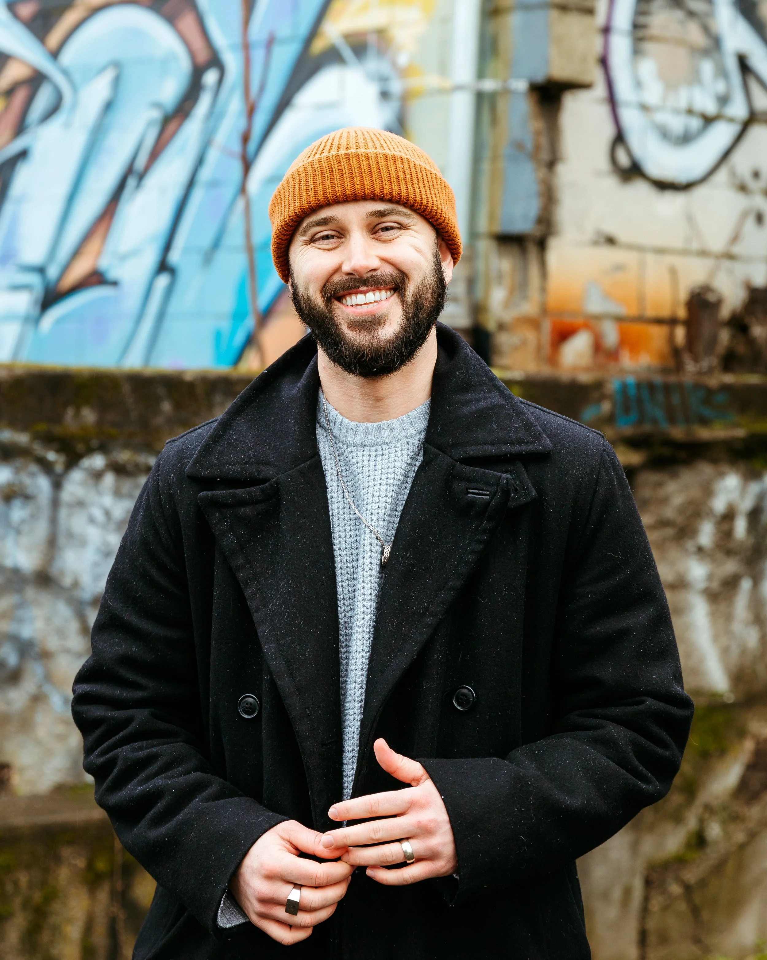 James Barnes, The Trans Coach, who is a motivational speaker and transition expert and transition coach smiles.