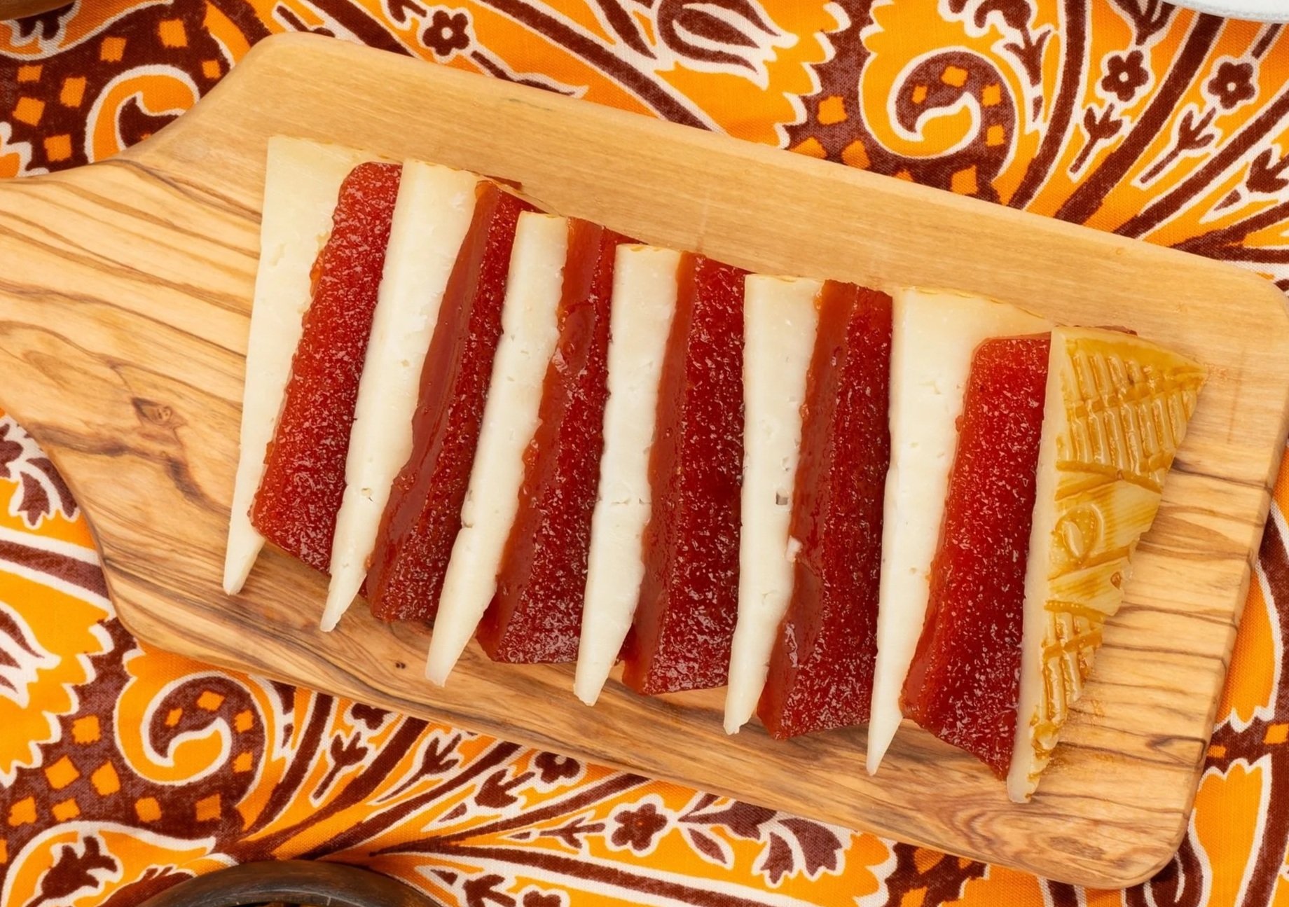 Ponce de Léon La Mancha & Membrillo Quince Paste on a patterned orange and brown cloth.