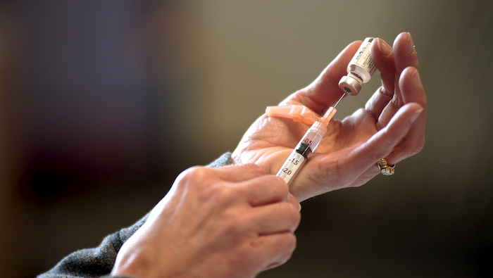 A nurse extracts the Covid-19, Johnson & Johnson vaccine at a clinic in Athens, Ohio