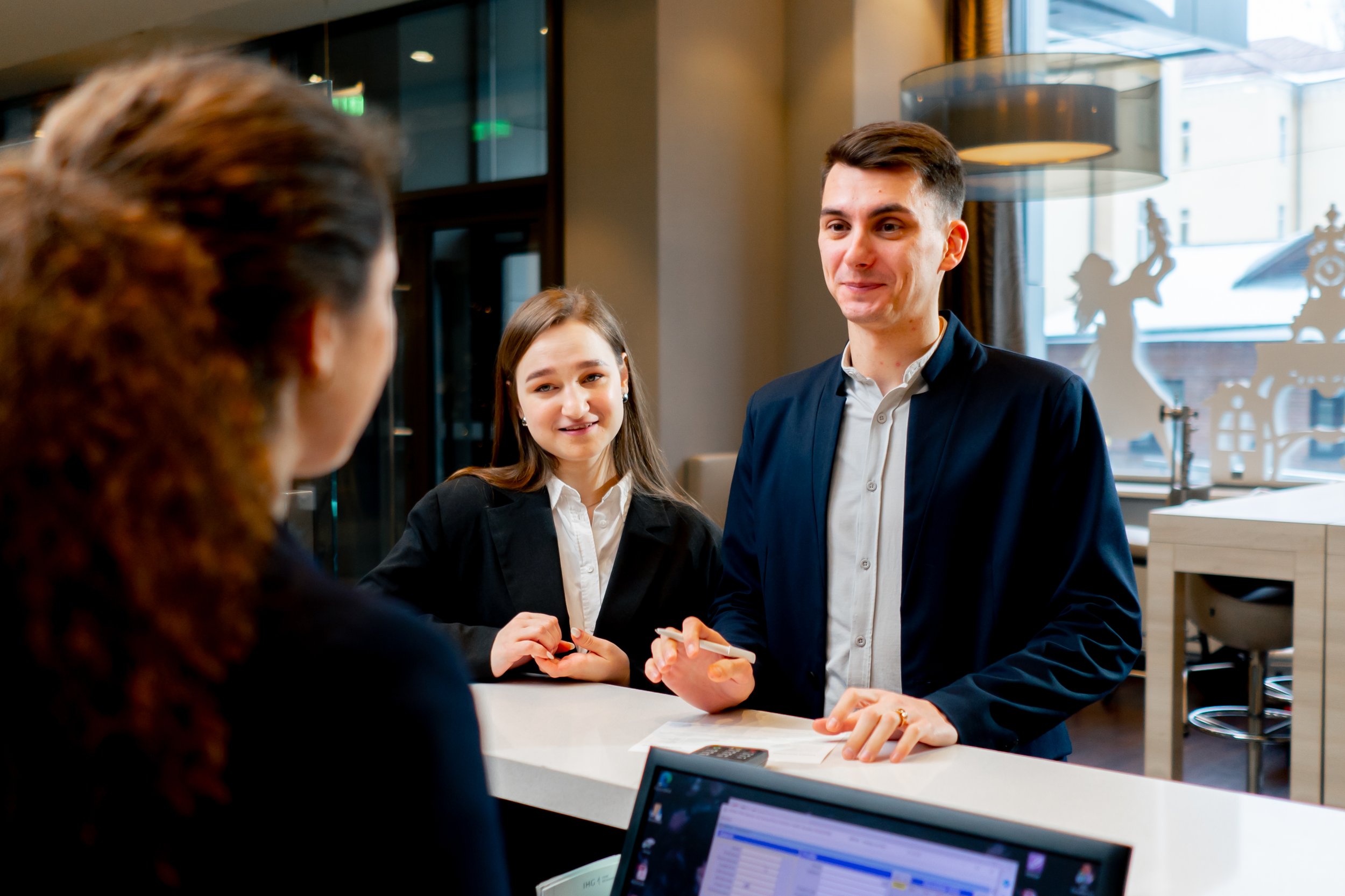 the-receptionist-at-the-counter-meets-guests-with-2024-02-07-20-23-54-utc.jpg