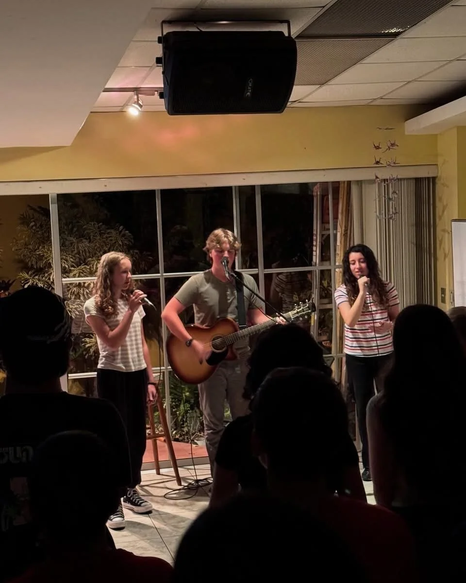 Clementine leading worship at AMCA