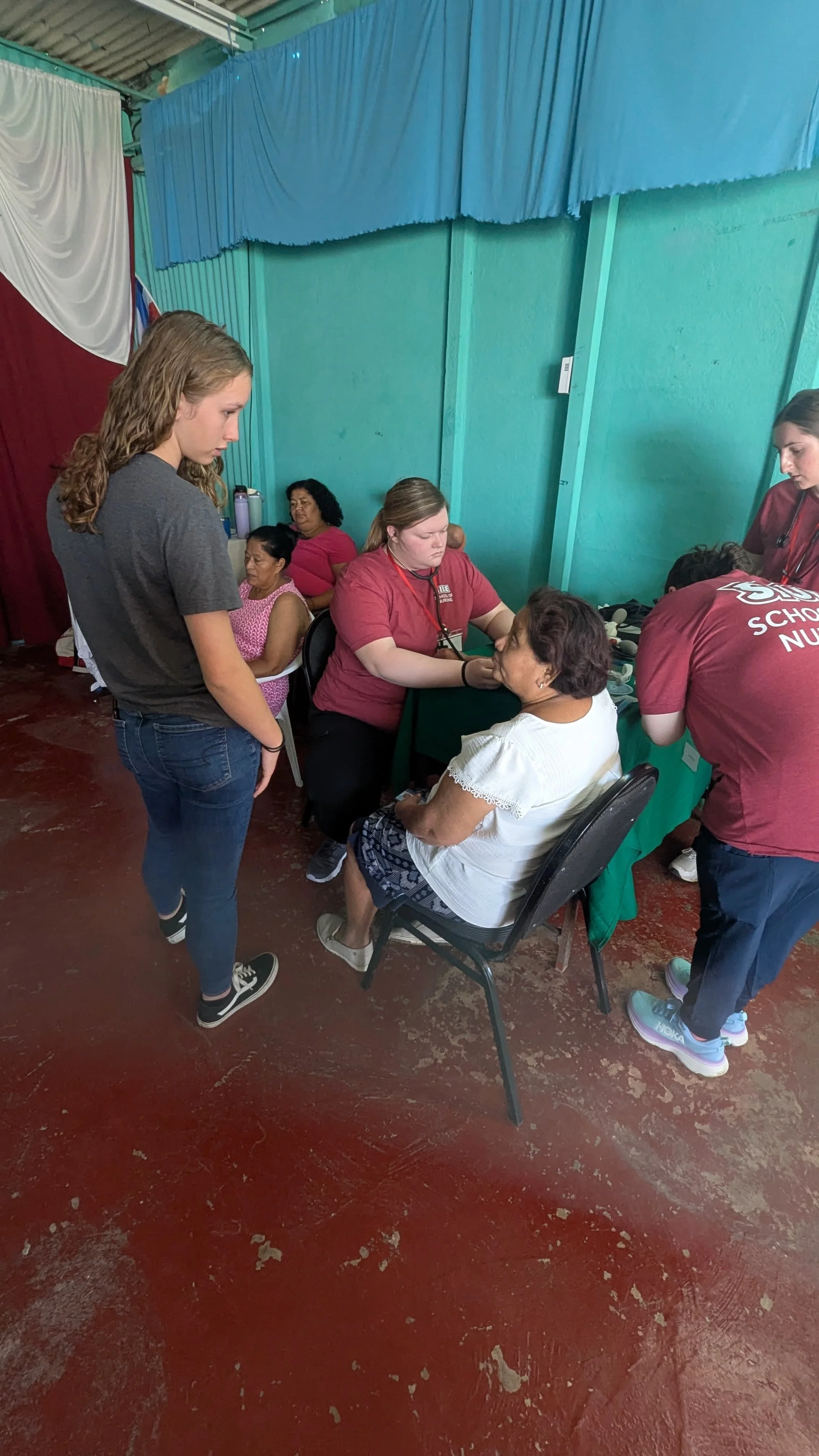Clementine (and Aspen) translating at CAMP's medical missions clinic